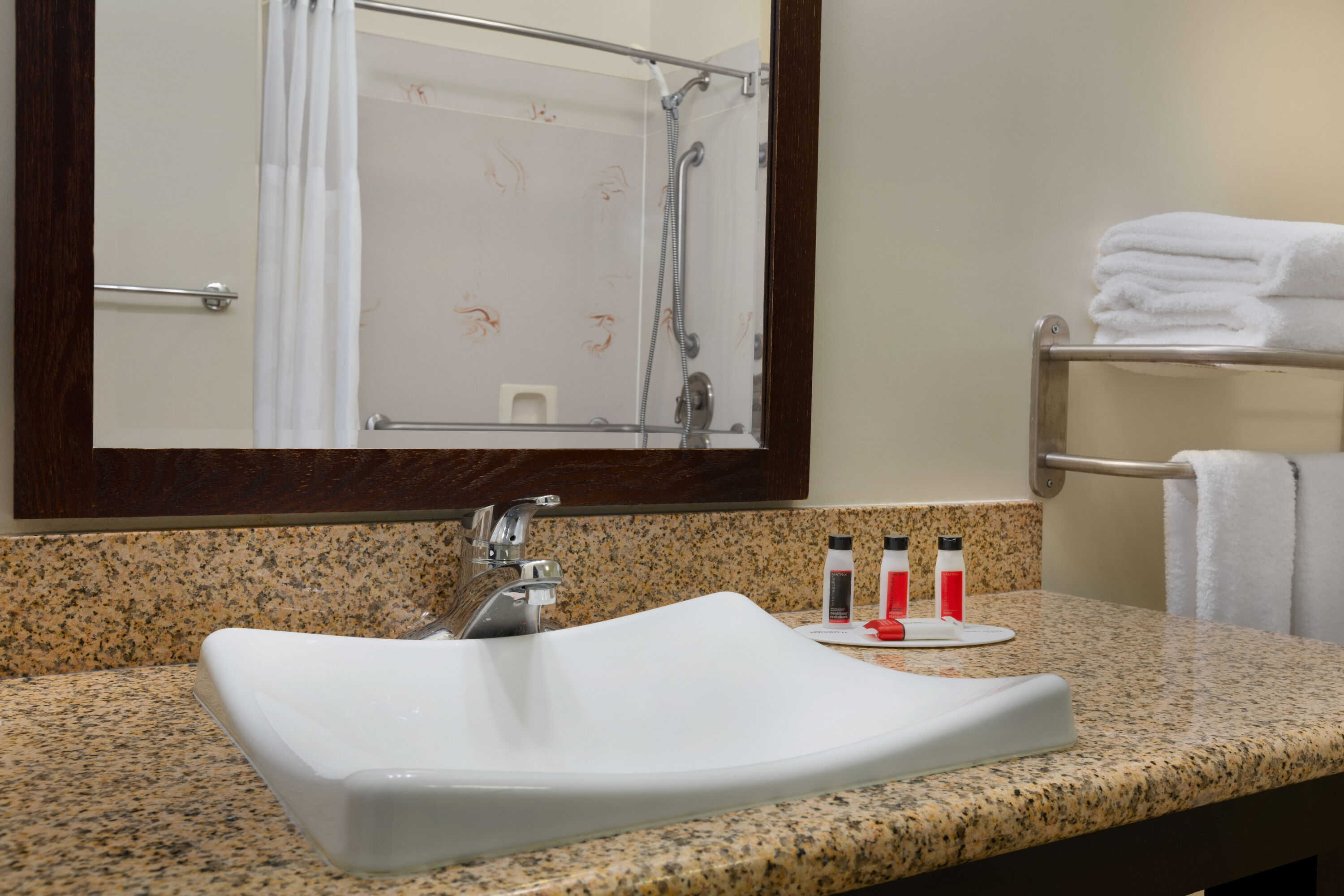 Guest room bath at the Ramada by Wyndham Oakland Downtown City Center in Oakland, California