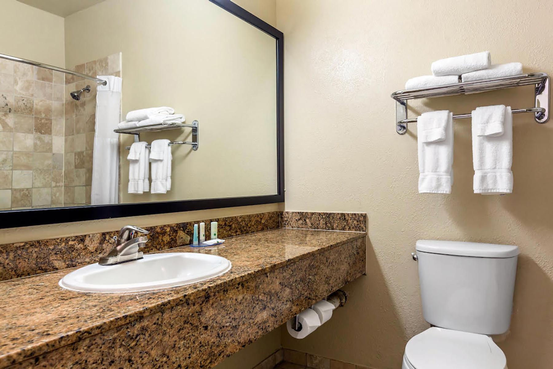 Guest room bath at the Ramada Suites by Wyndham San Diego/Hotel Circle Area in San Diego, California