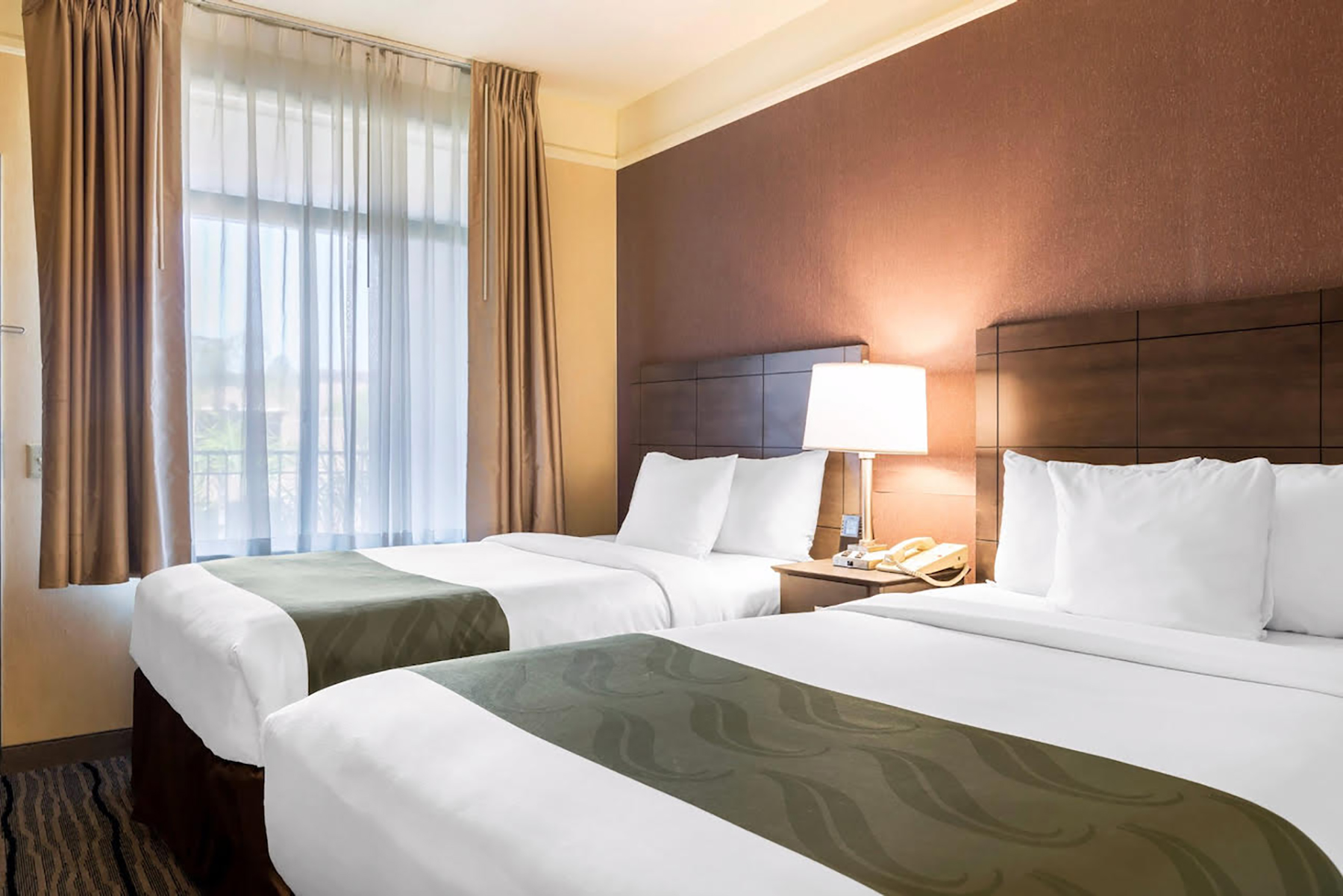 Guest room at the Ramada Suites by Wyndham San Diego/Hotel Circle Area in San Diego, California