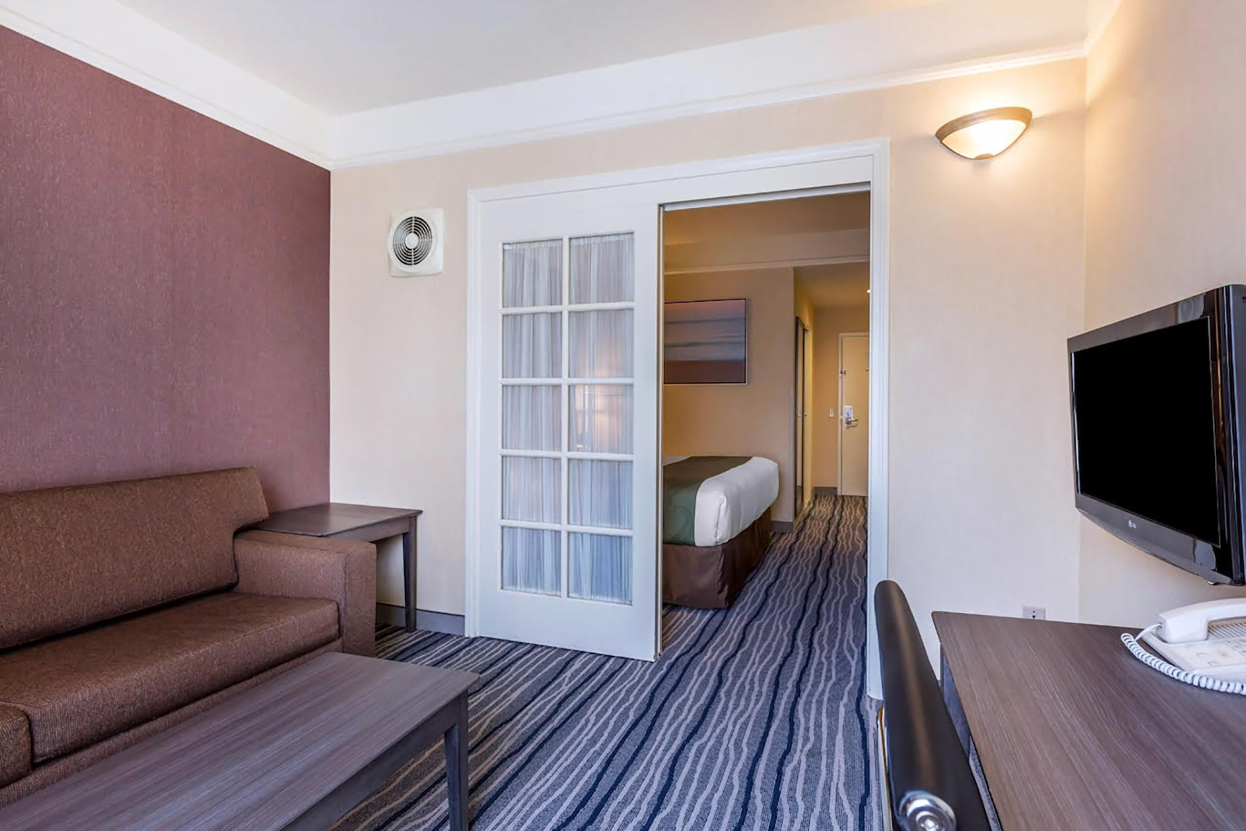 Guest room at the Ramada Suites by Wyndham San Diego/Hotel Circle Area in San Diego, California