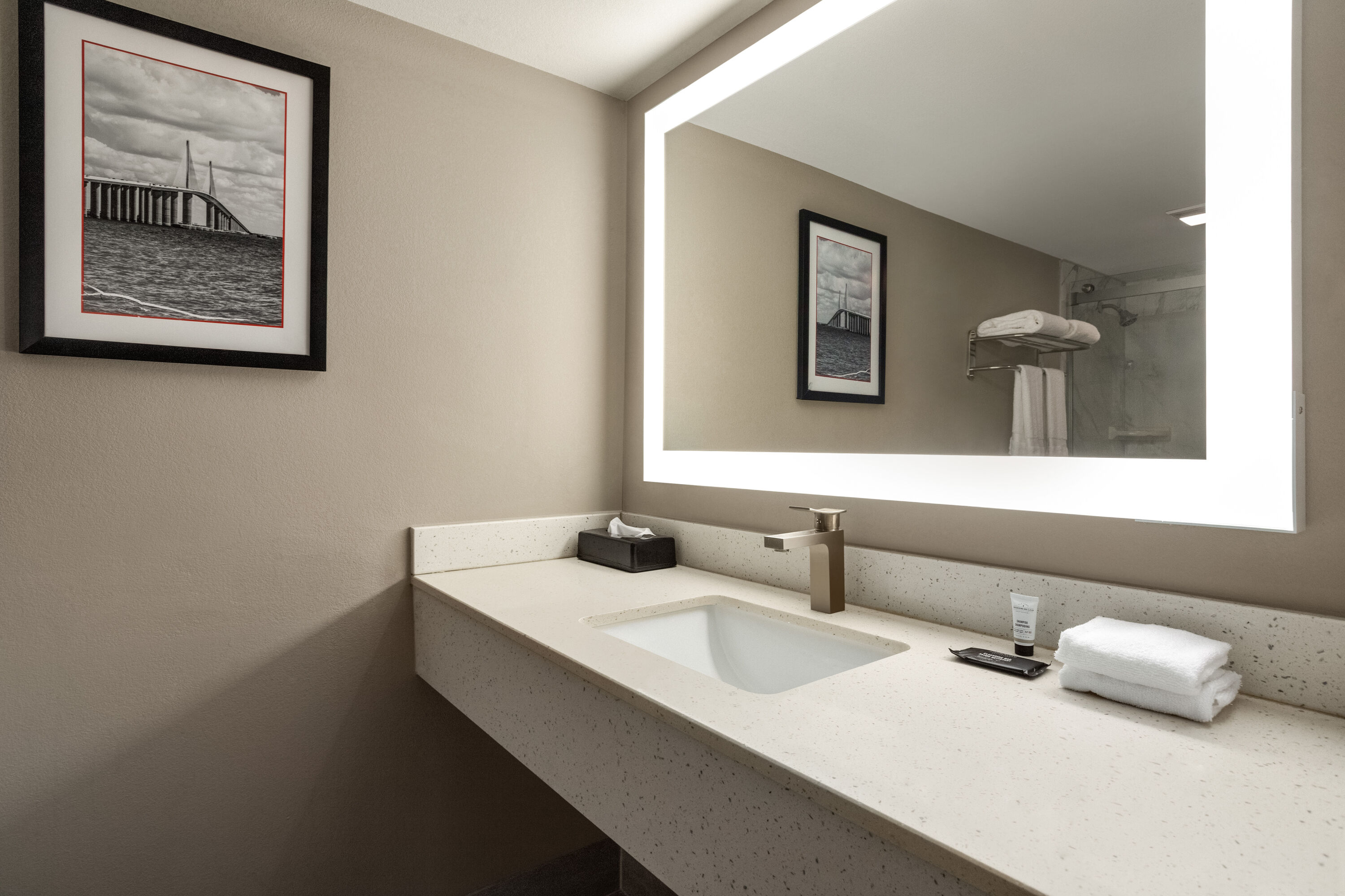 Guest room bath at the Ramada by Wyndham Cocoa in Cocoa, Florida