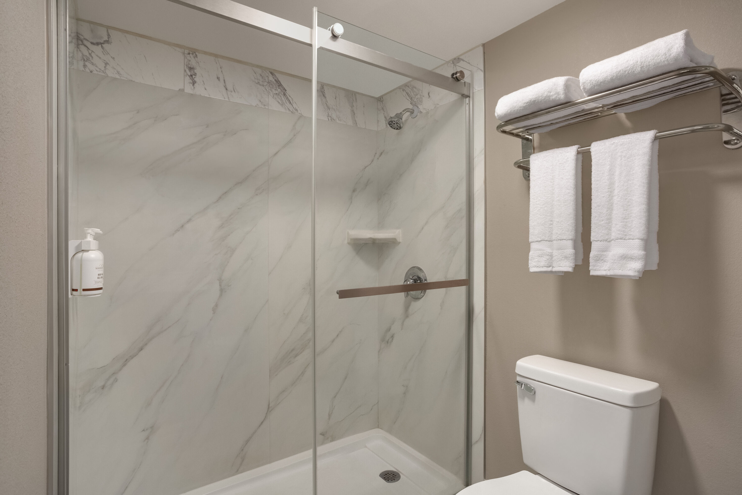 Guest room bath at the Ramada by Wyndham Cocoa in Cocoa, Florida