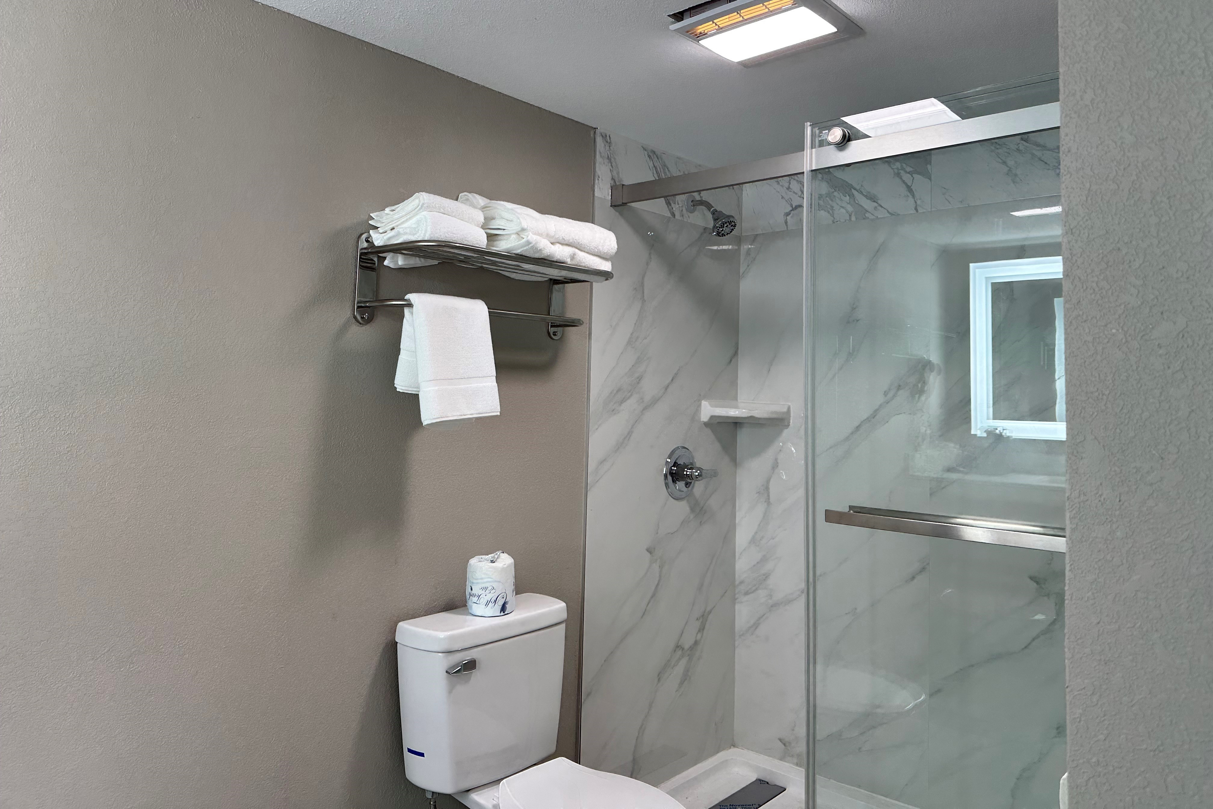 Guest room bath at the Ramada by Wyndham Cocoa in Cocoa, Florida