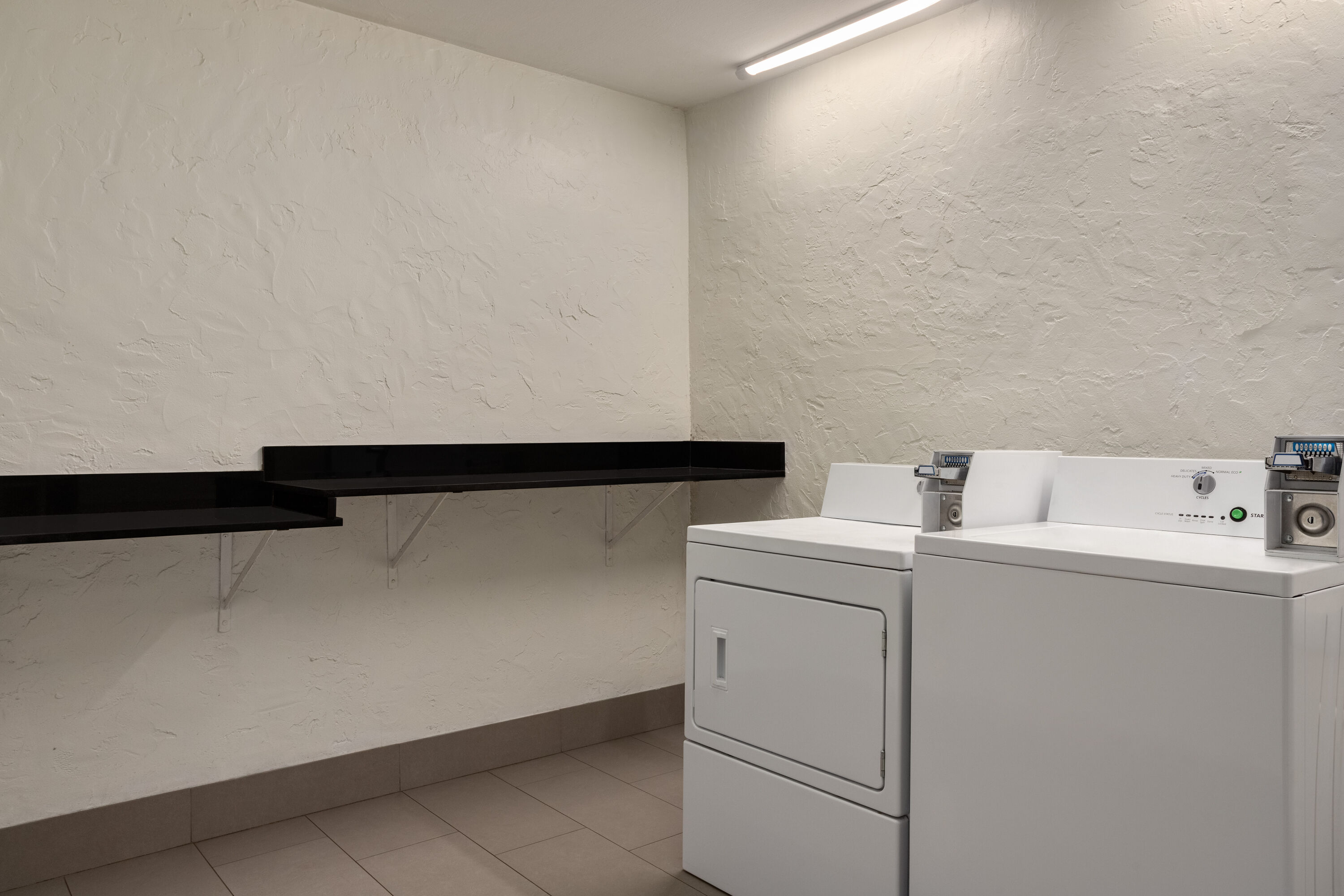 Laundry facilities at Ramada by Wyndham Cocoa in Cocoa, Florida