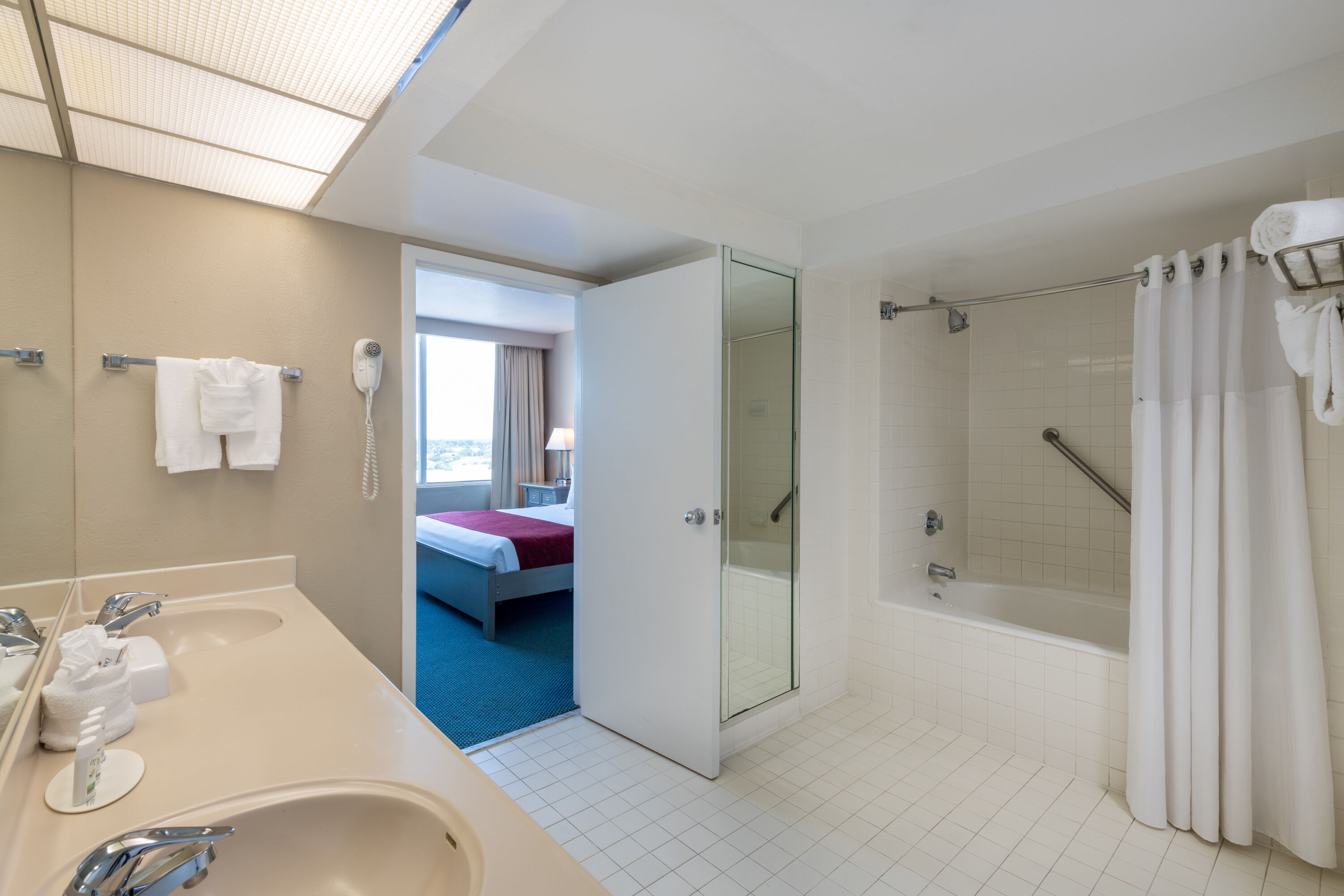 Guest room bath at the Ramada by Wyndham Kissimmee Gateway in Kissimmee, Florida