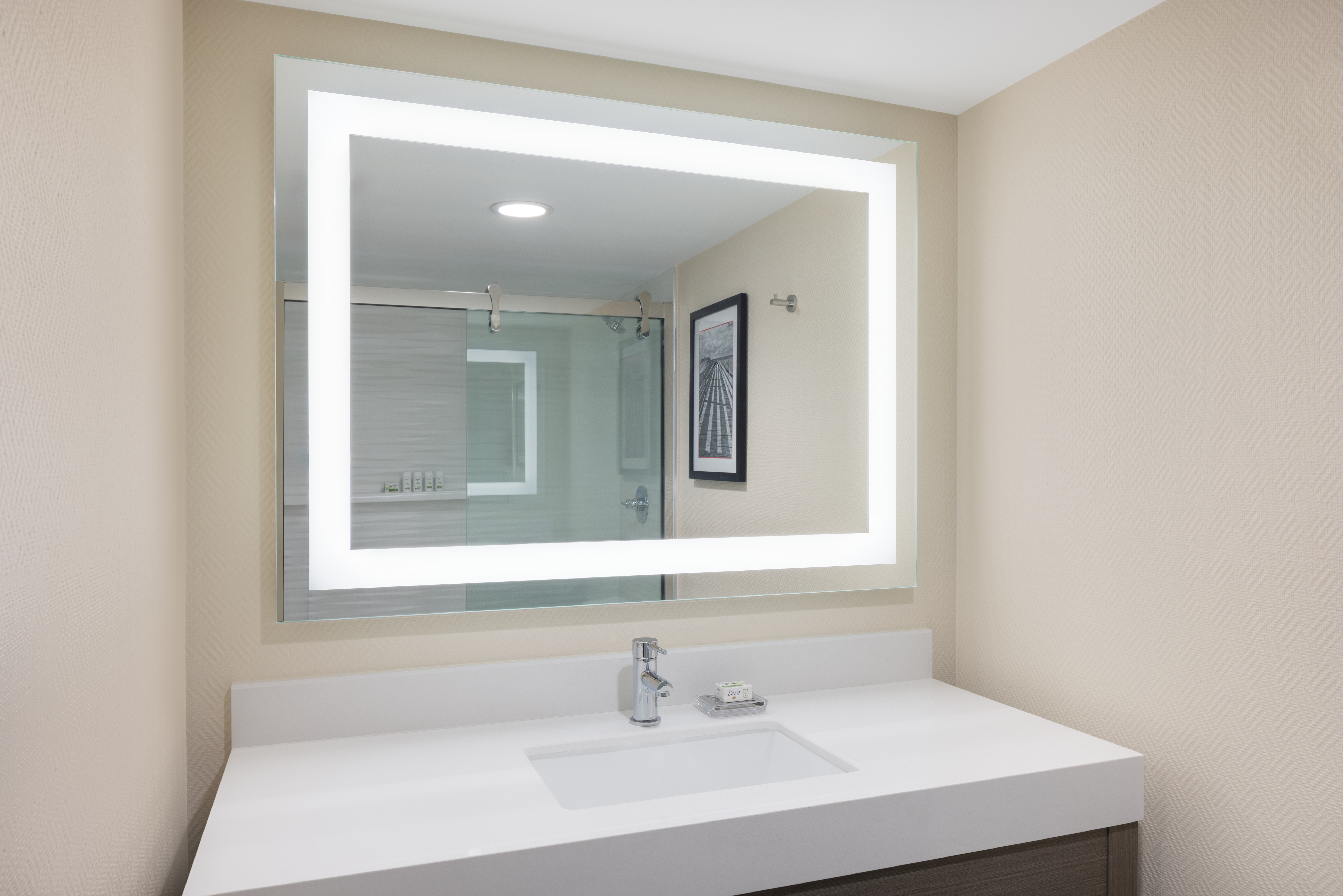 Guest room bath at the Ramada Plaza by Wyndham Orlando Resort & Suites Intl Drive in Orlando, Florida