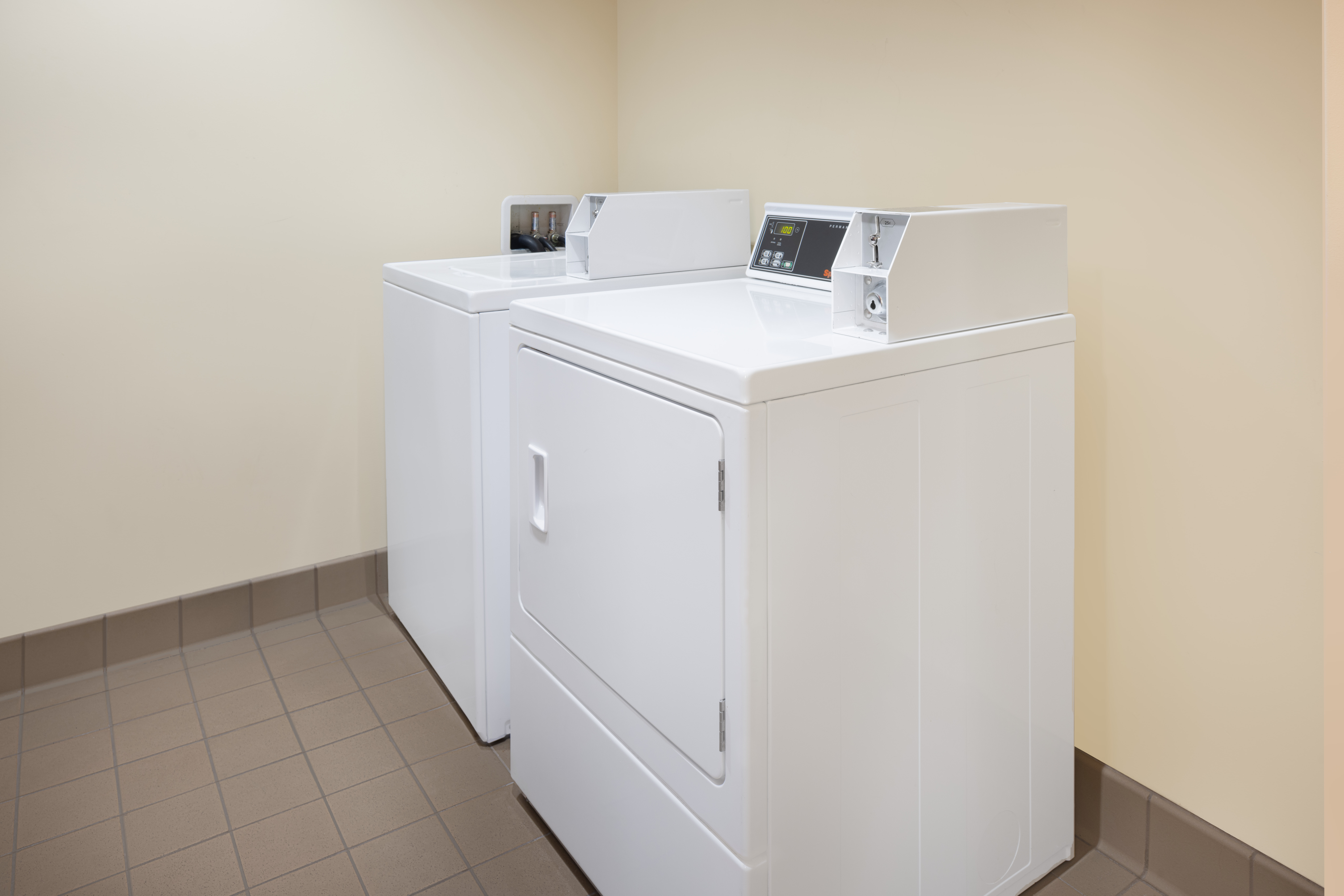 Laundry facilities at Ramada Plaza by Wyndham Orlando Resort & Suites Intl Drive in Orlando, Florida