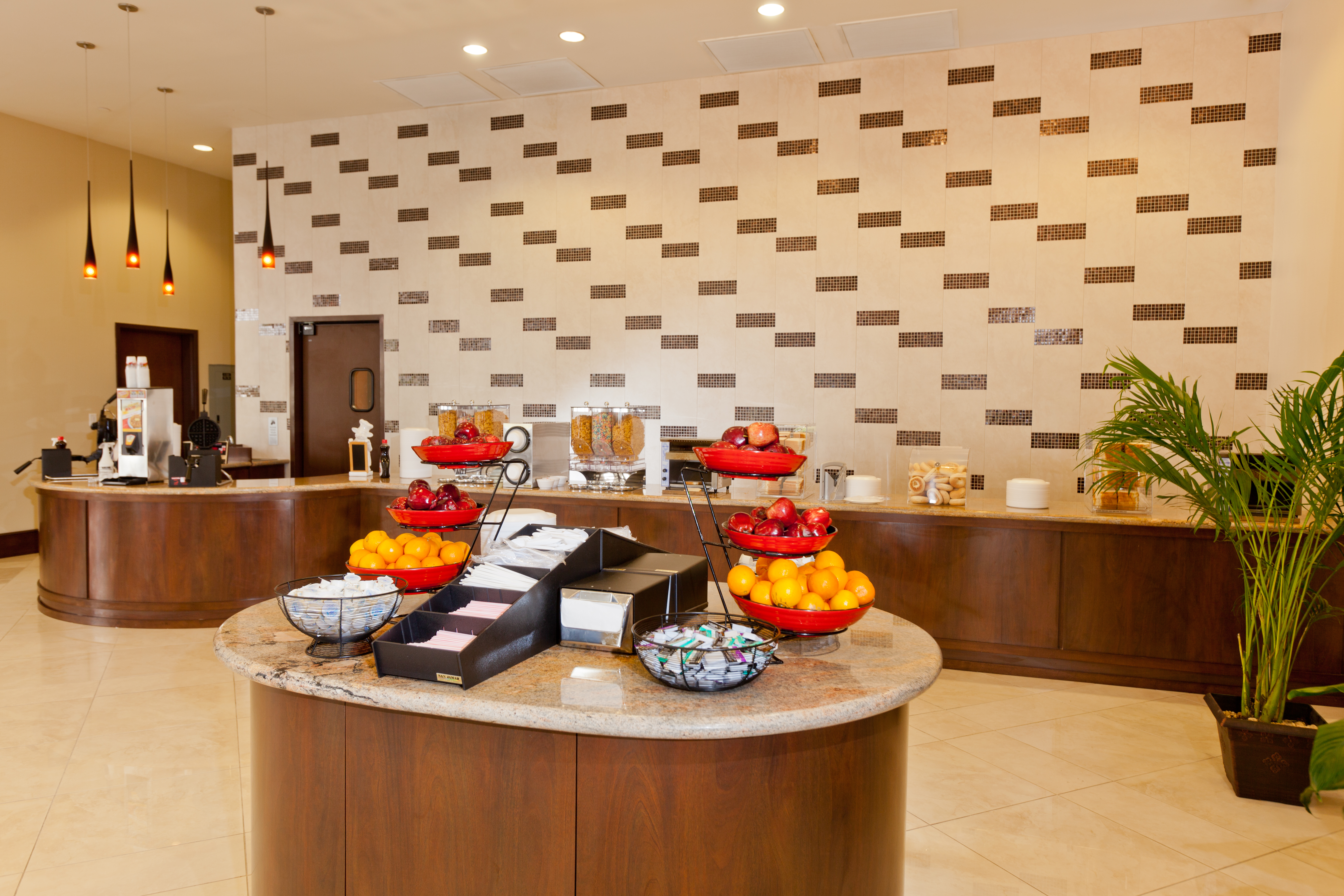 Ramada Plaza by Wyndham Orlando Resort & Suites Intl Drive restaurant breakfast area with seating in Orlando, Florida