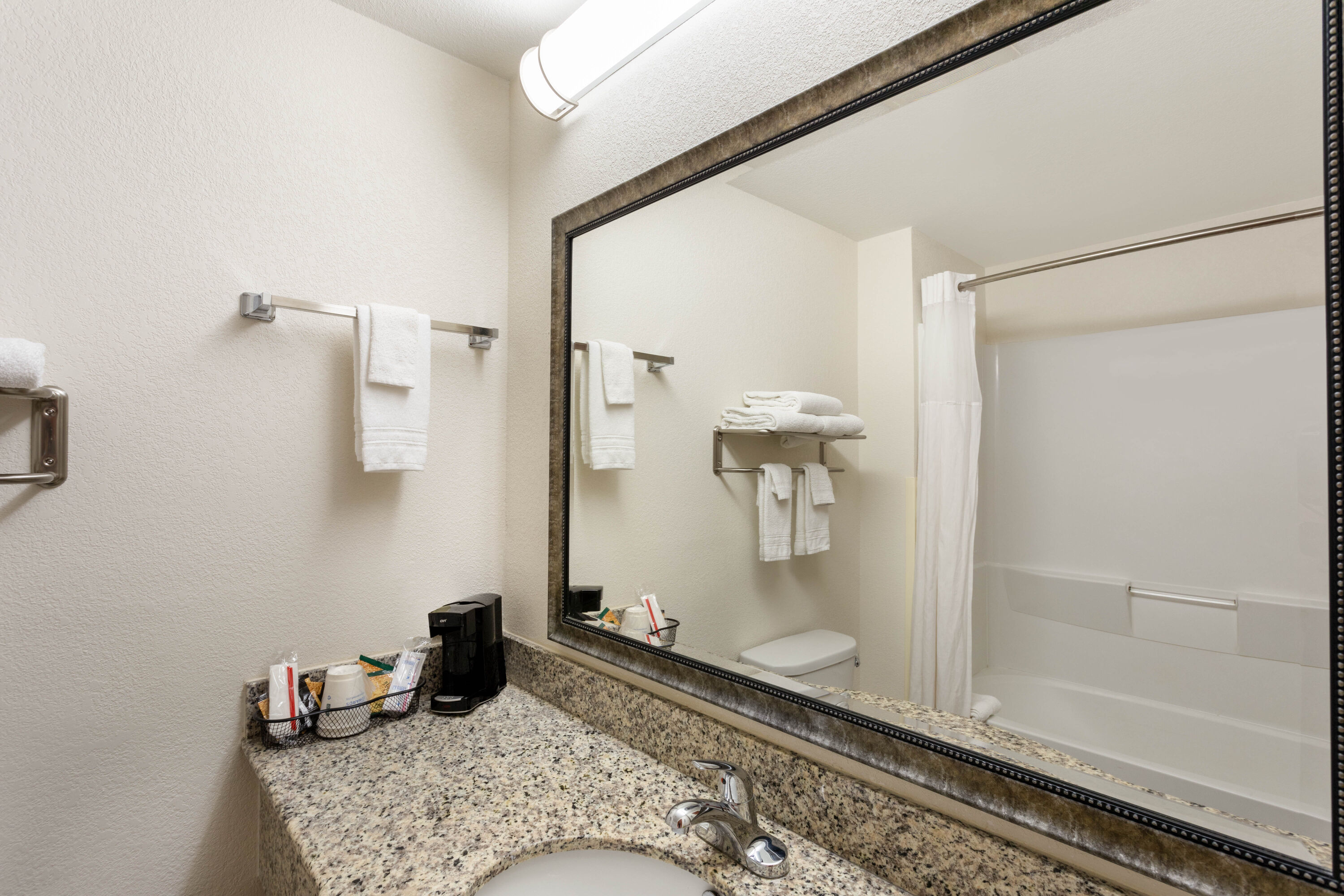 Guest room bath at the Ramada by Wyndham Panama City in Panama City, Florida