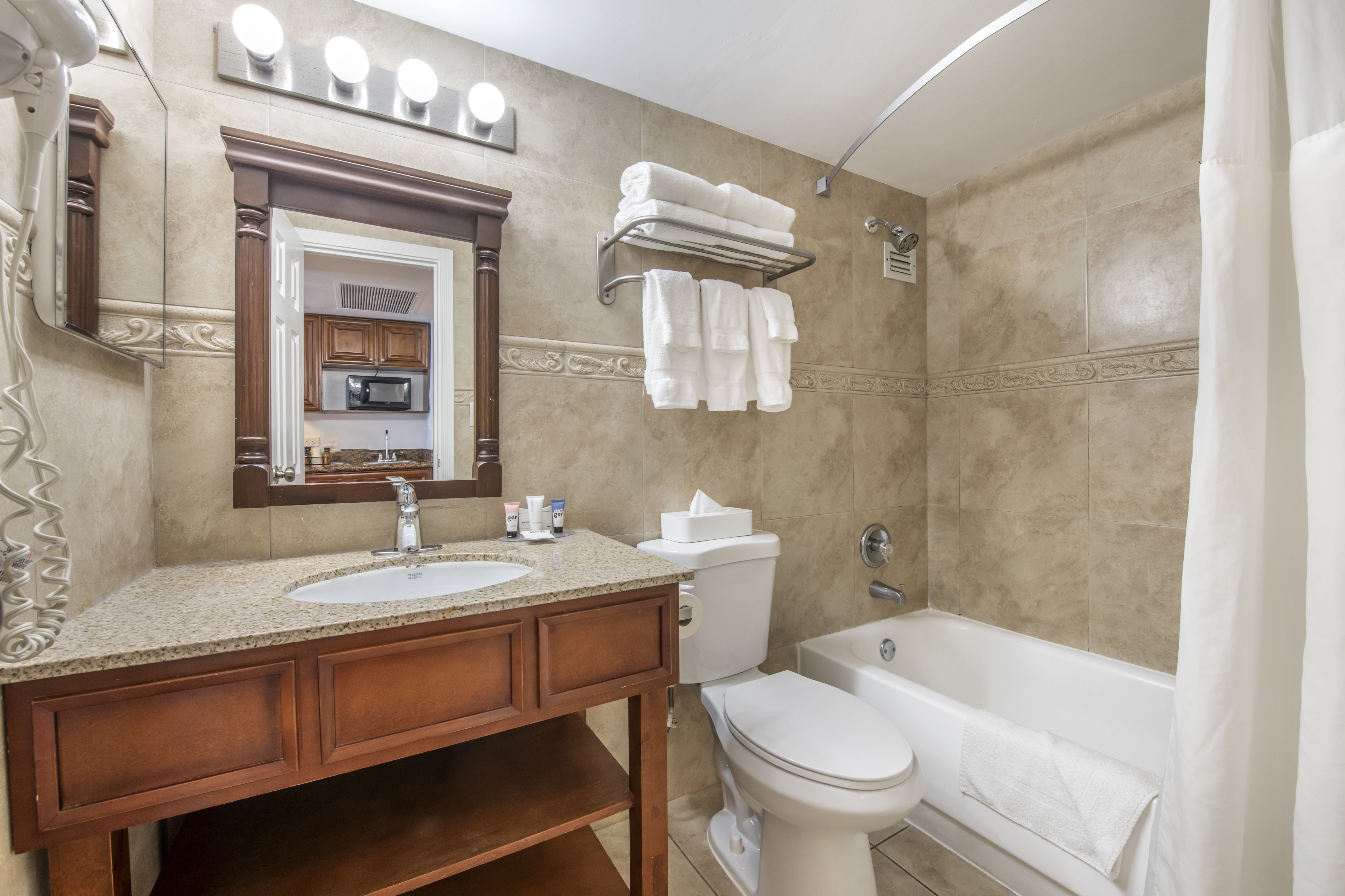 Guest room bath at the Ramada Plaza by Wyndham Marco Polo Beach Resort in Sunny Isles Beach, Florida