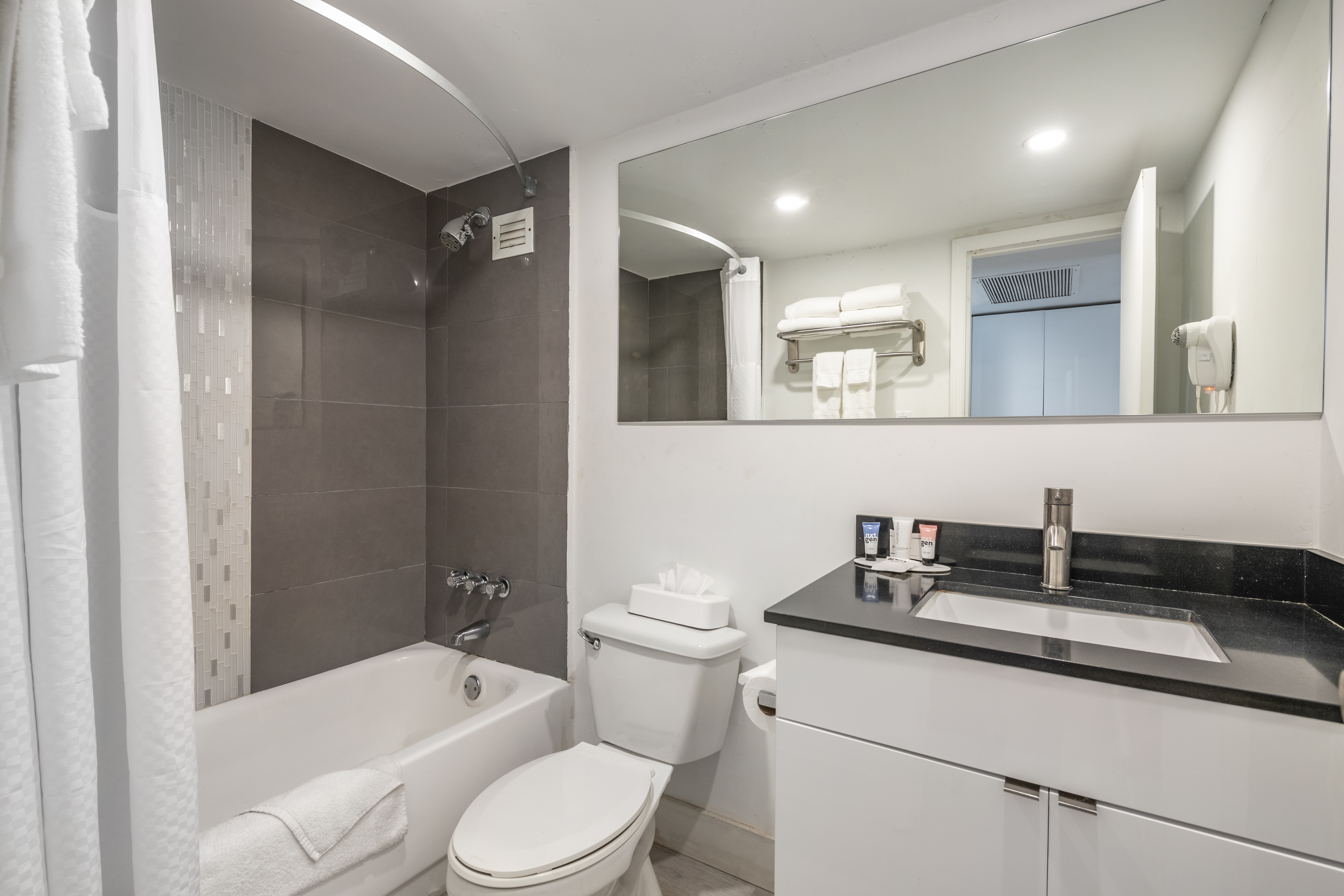 Guest room bath at the Ramada Plaza by Wyndham Marco Polo Beach Resort in Sunny Isles Beach, Florida