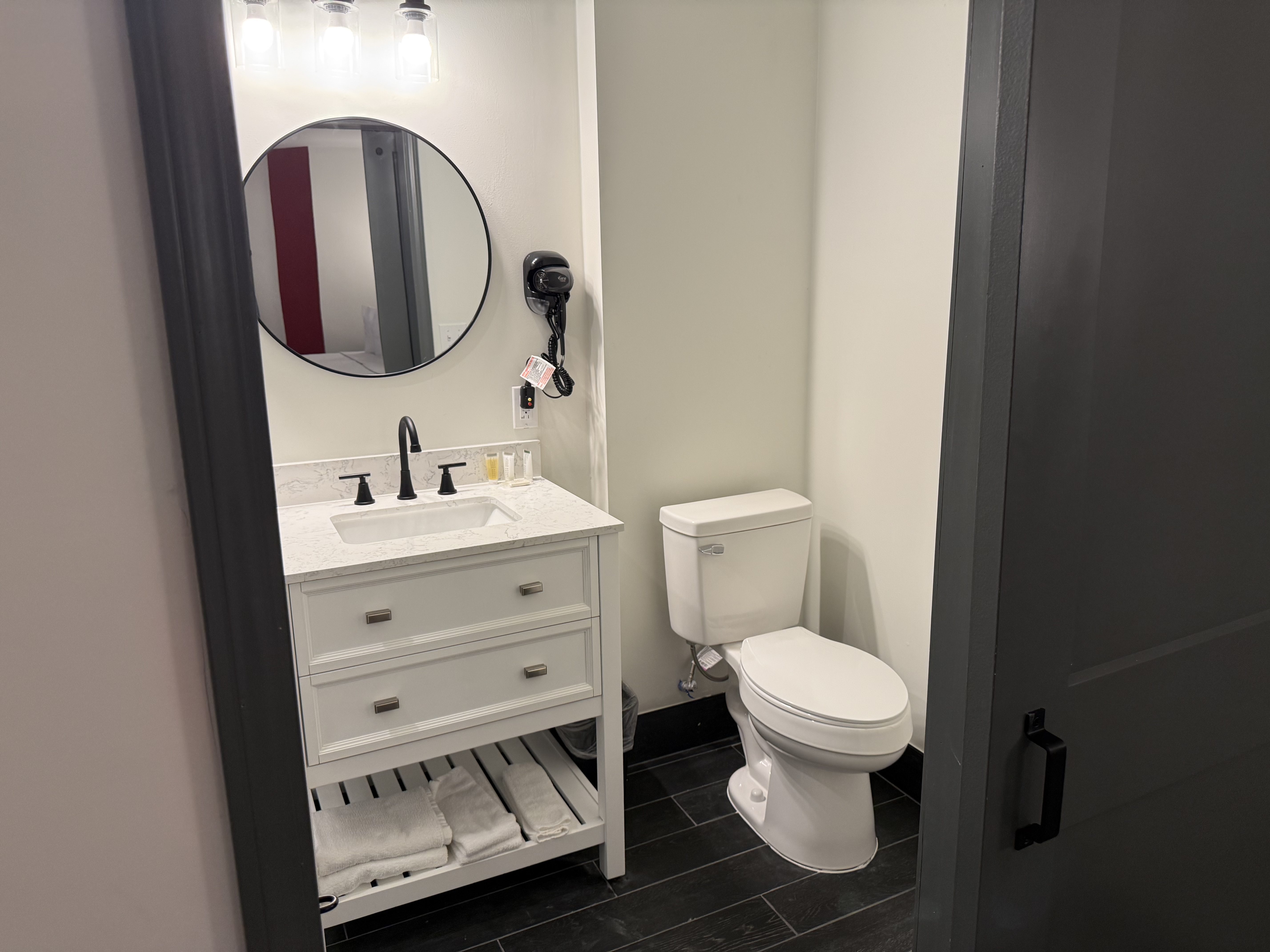 Guest room bath at the Ramada by Wyndham Albany GA in Albany, Georgia