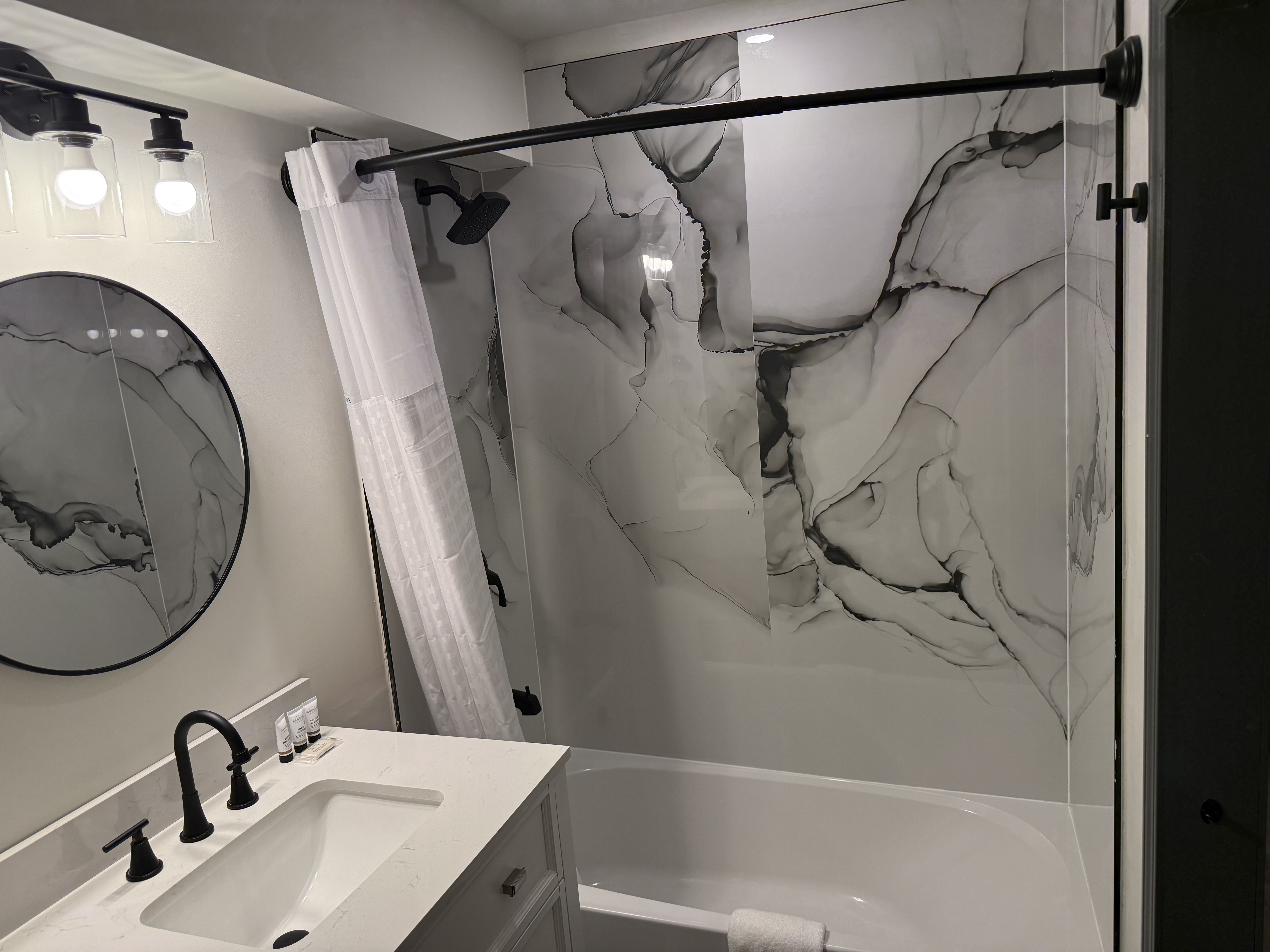 Guest room bath at the Ramada by Wyndham Albany GA in Albany, Georgia