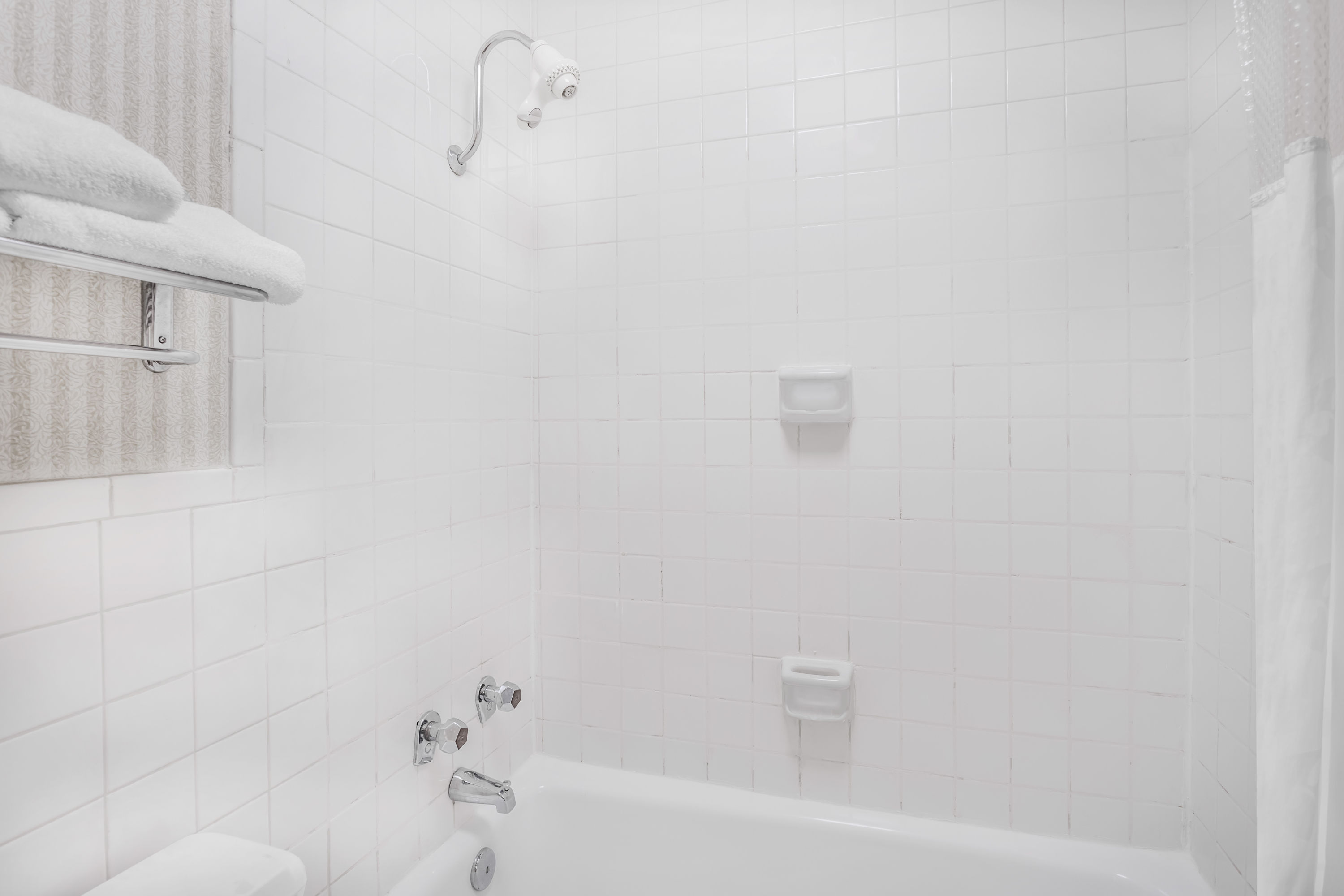 Guest room bath at the Ramada by Wyndham Macon in Macon, Georgia