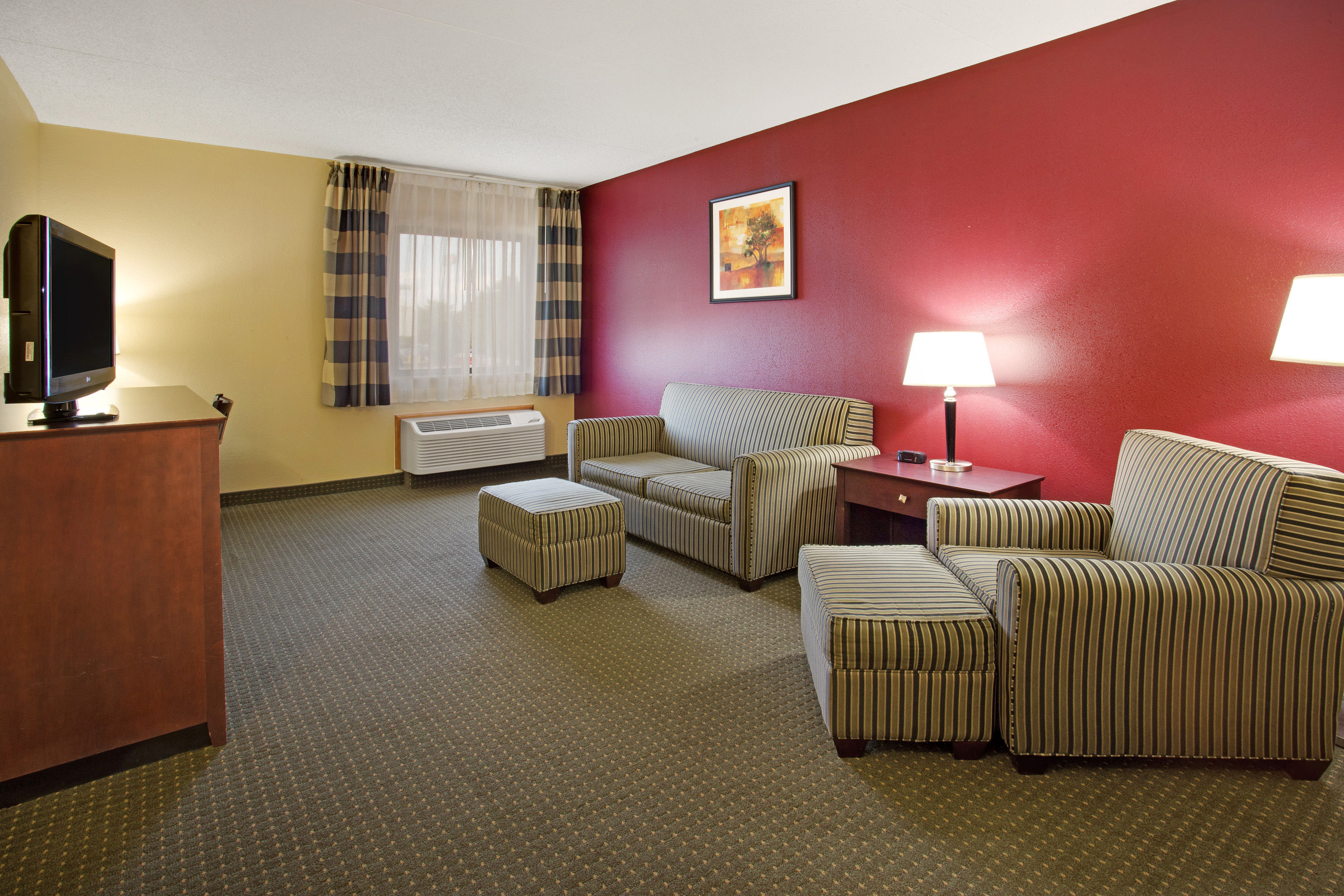 Ramada by Wyndham Bettendorf suite living room in Bettendorf, Iowa