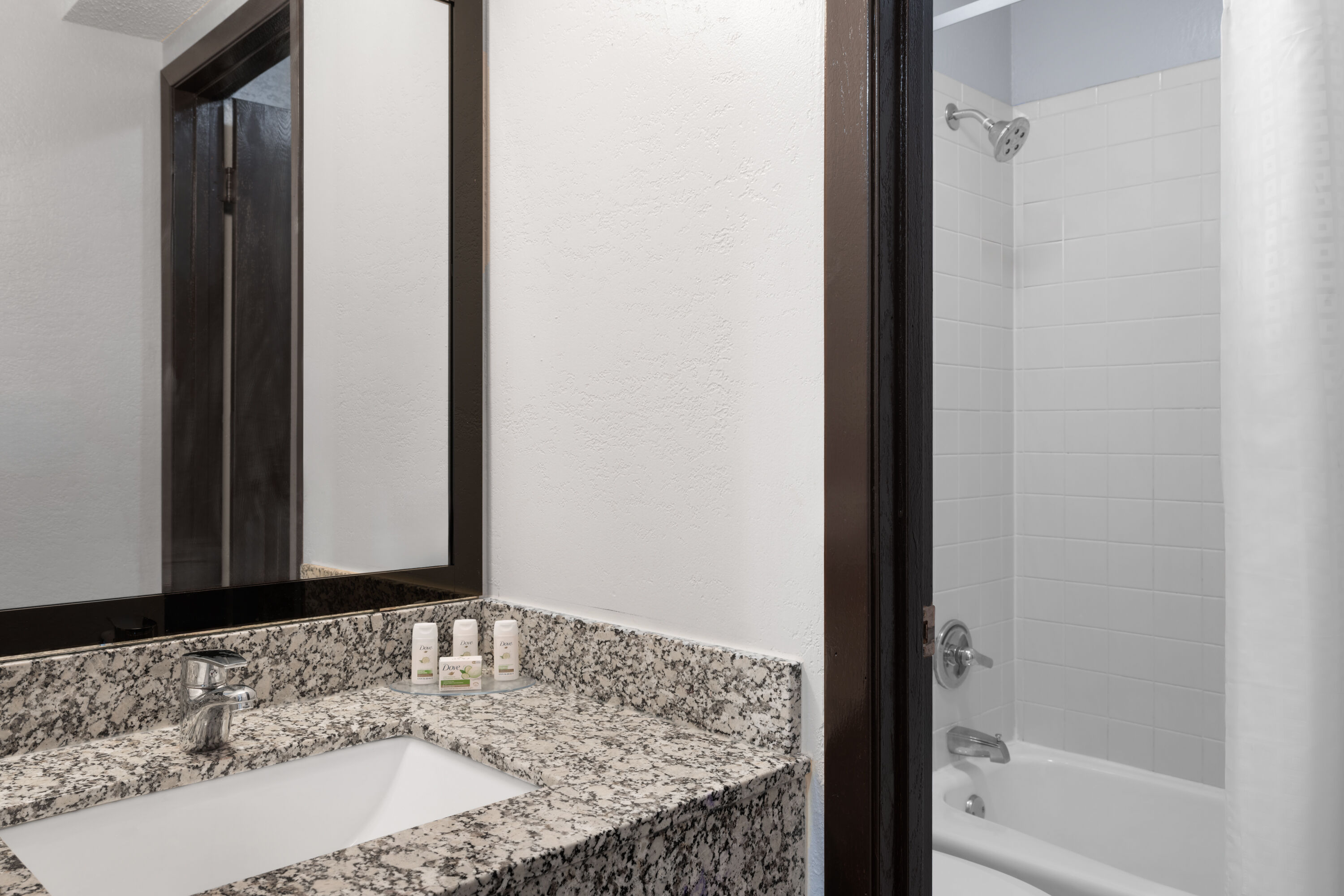 Guest room bath at the Ramada by Wyndham Cedar Rapids South in Cedar Rapids, Iowa