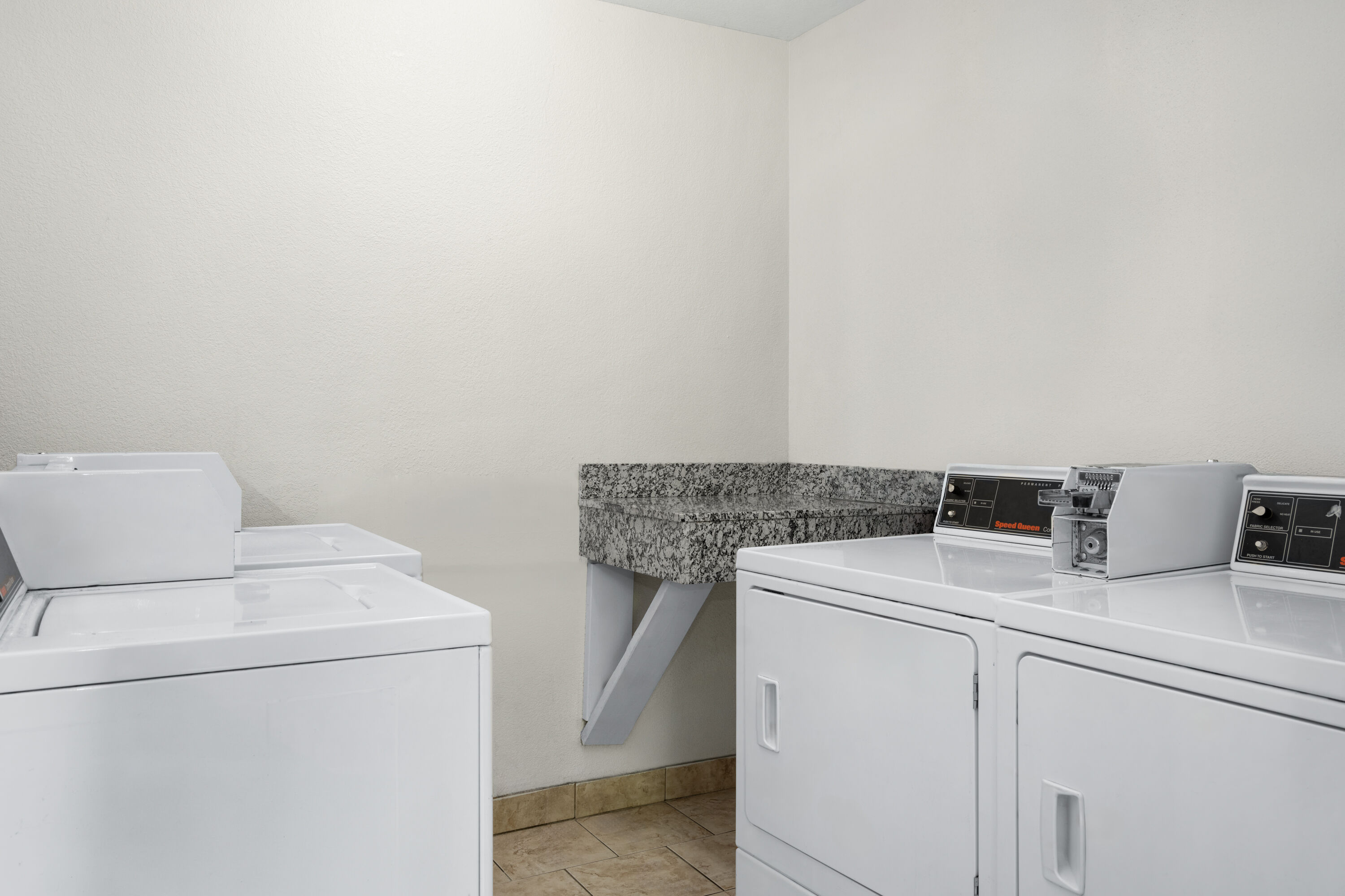 Laundry facilities at Ramada by Wyndham Cedar Rapids South in Cedar Rapids, Iowa