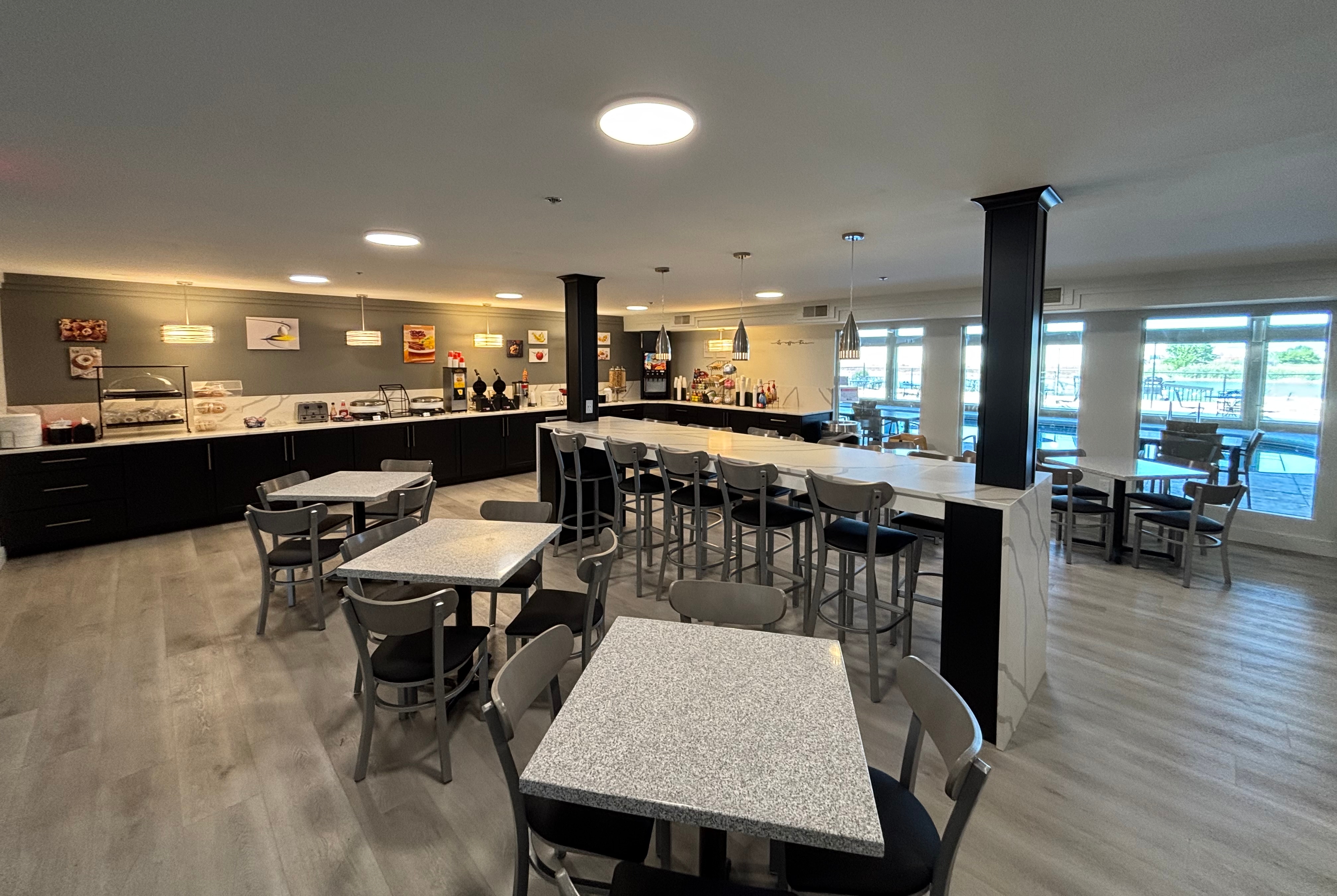 Ramada by Wyndham Springfield North restaurant breakfast area with seating in Springfield, Illinois