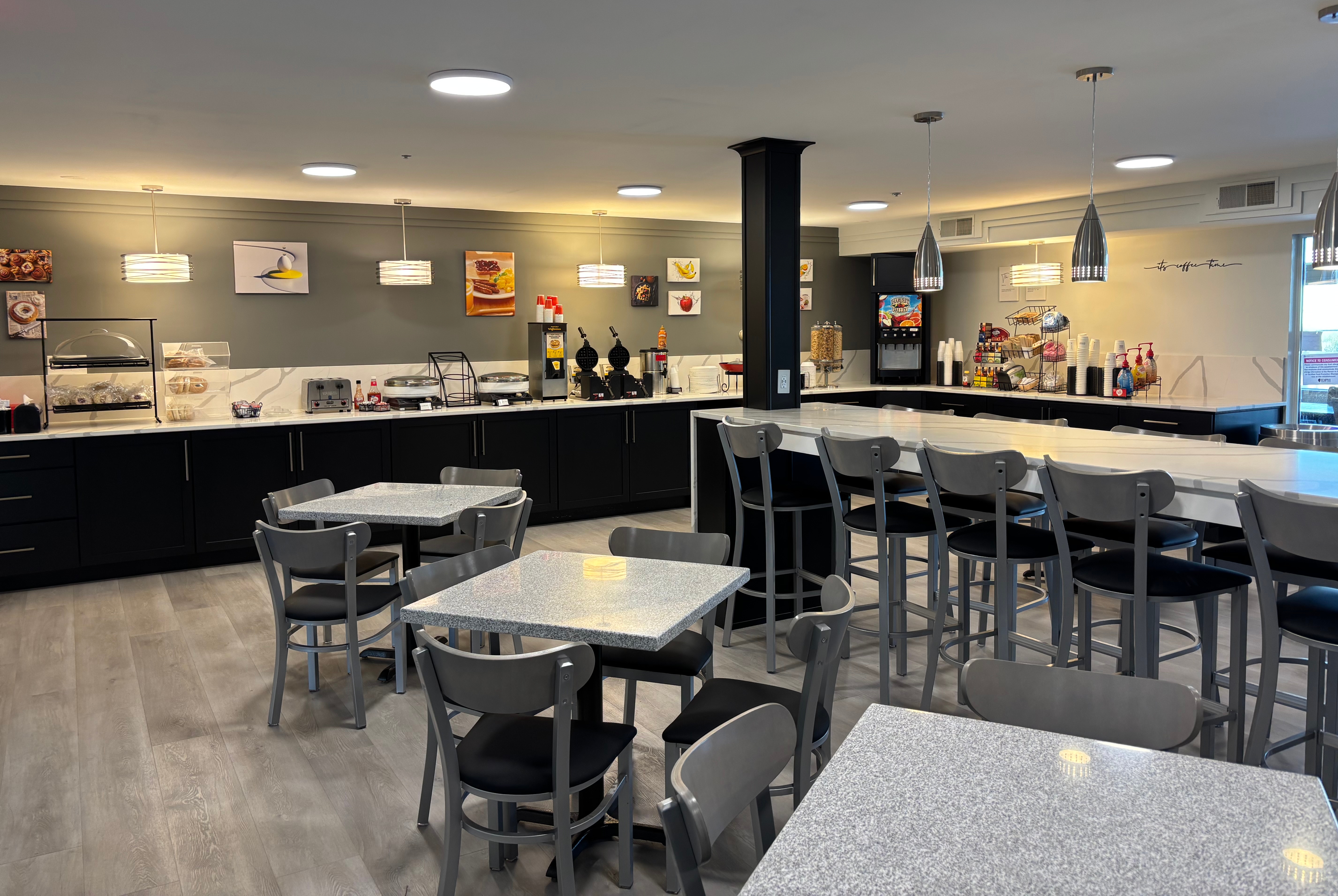 Ramada by Wyndham Springfield North restaurant breakfast area with seating in Springfield, Illinois