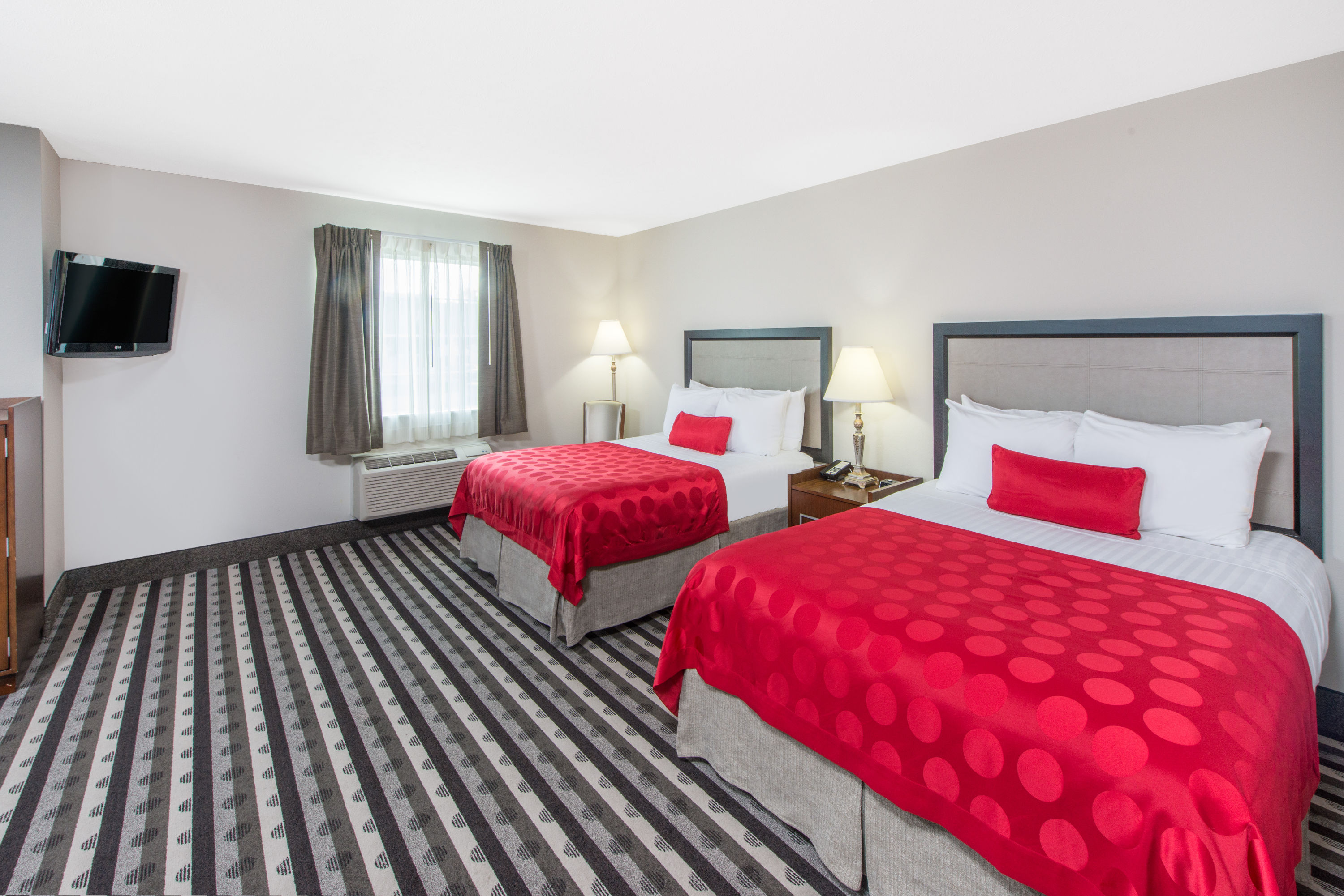 Guest room at the Ramada by Wyndham Springfield North in Springfield, Illinois
