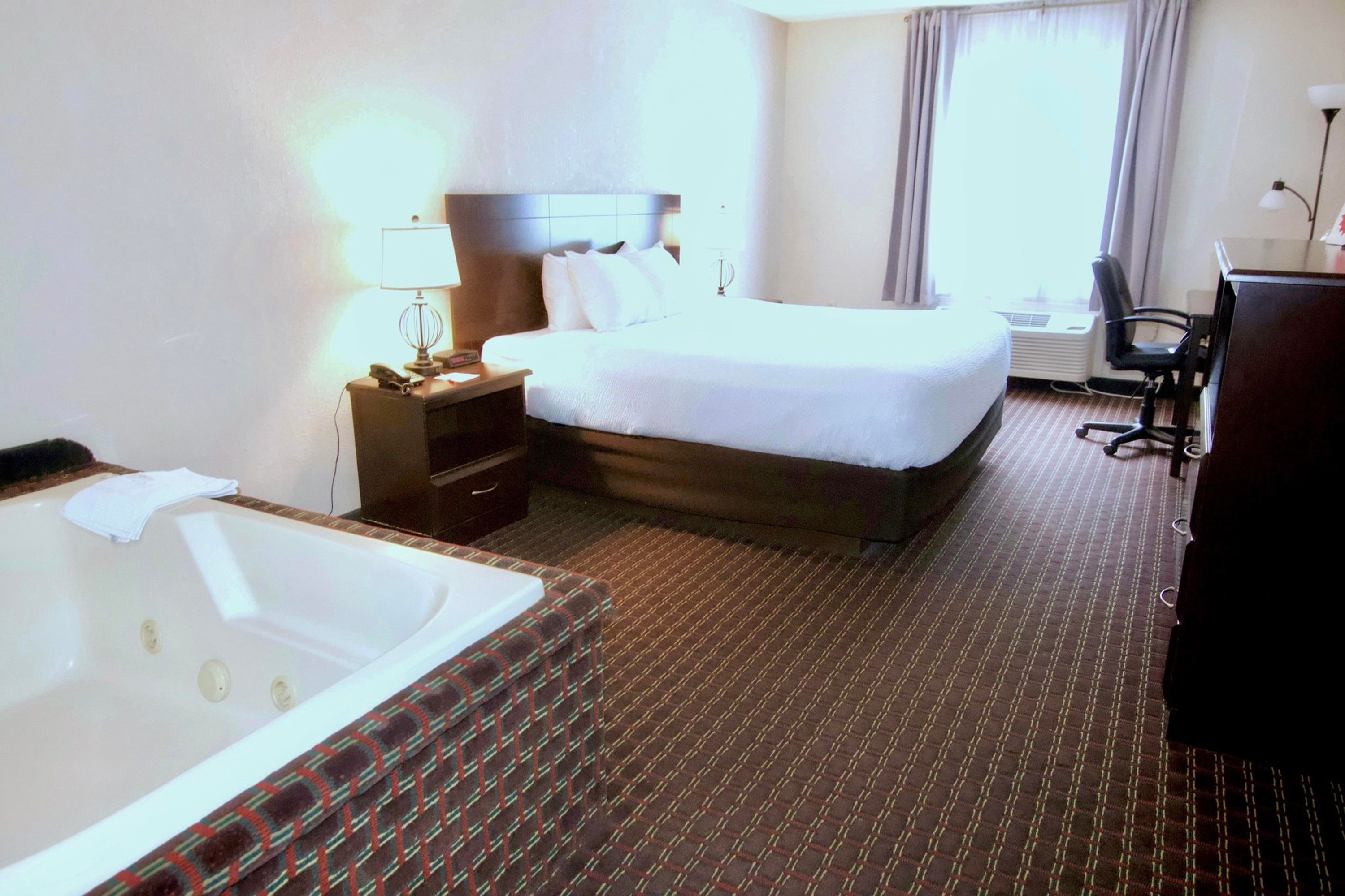 Guest room at the Ramada by Wyndham Tell City in Tell City, Indiana