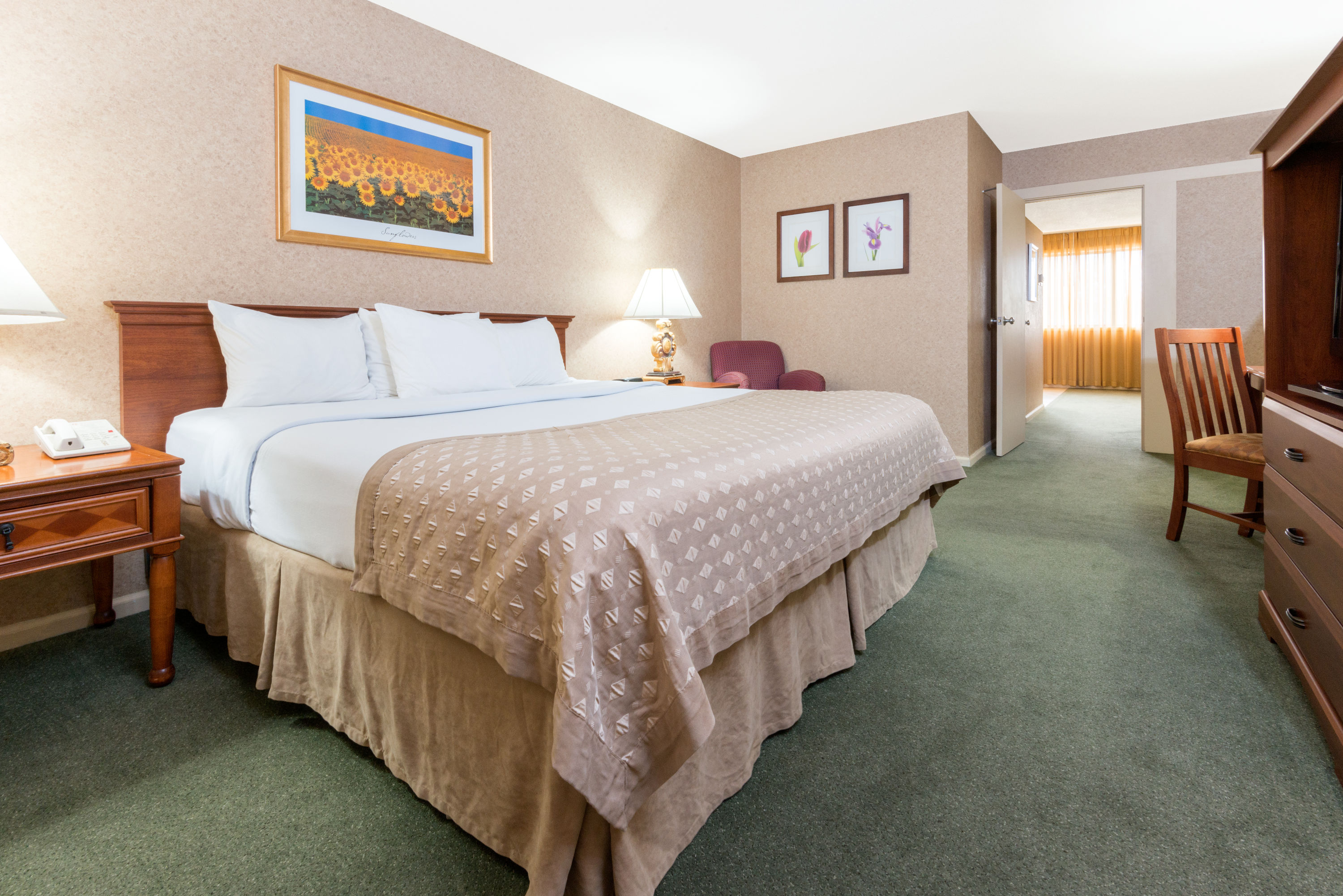 Guest room at the Ramada by Wyndham Topeka Downtown Hotel & Convention Center in Topeka, Kansas