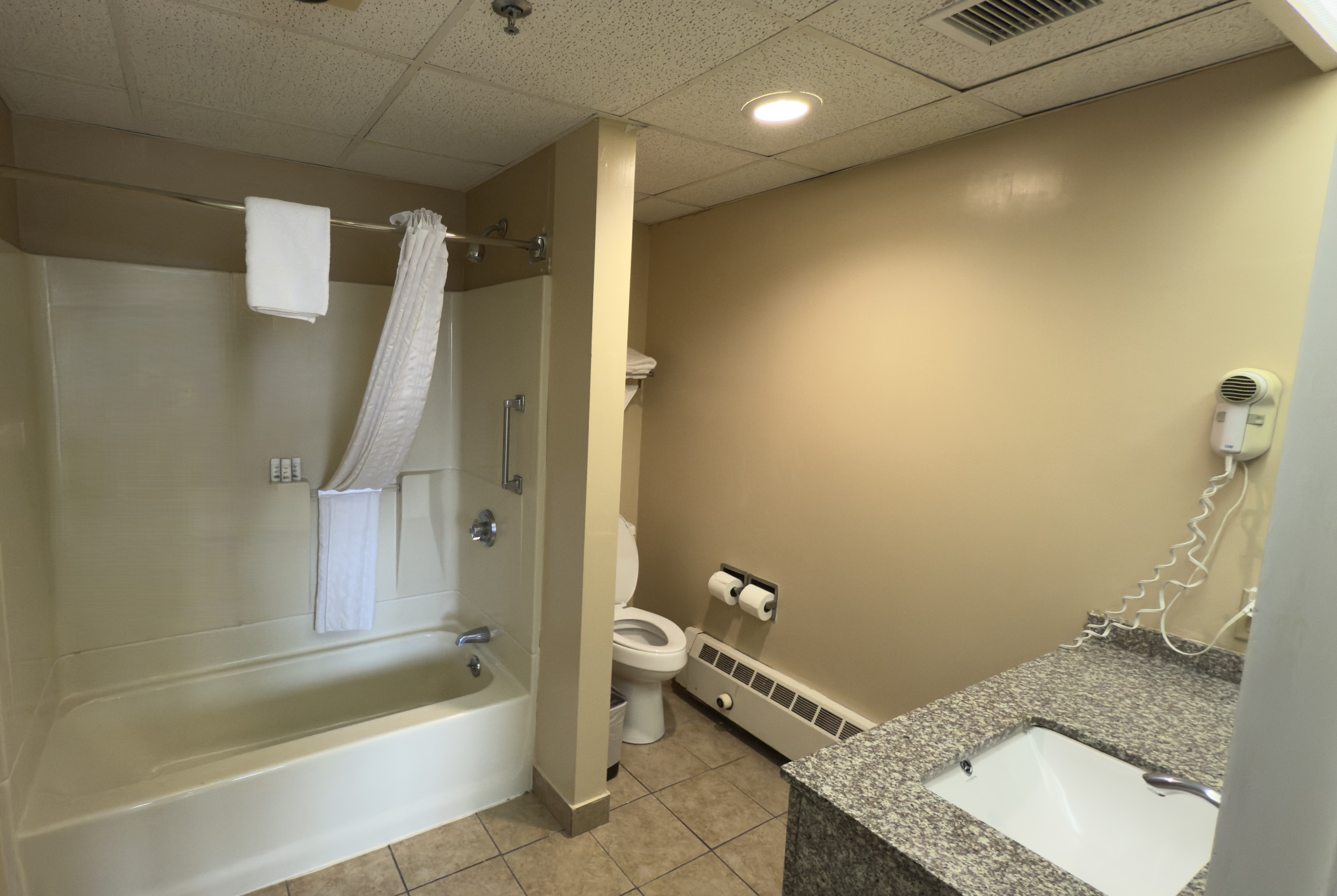 Guest room bath at the Ramada by Wyndham Seekonk Providence Area in Seekonk, Massachusetts