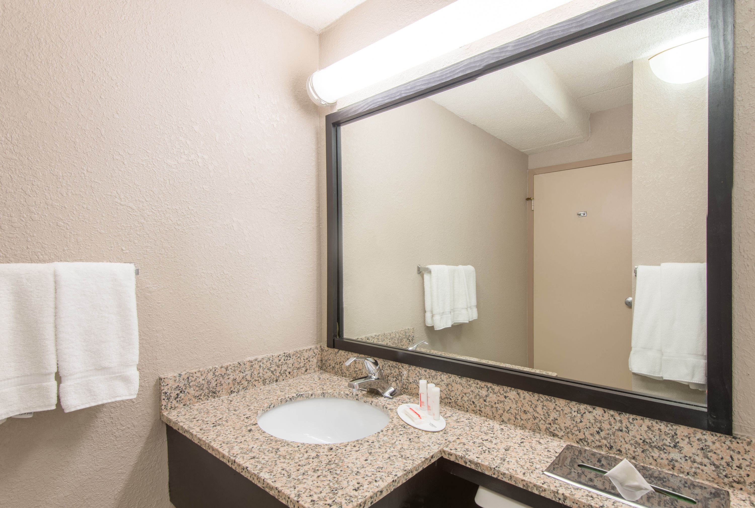 Guest room bath at the Ramada by Wyndham Cumberland Downtown in Cumberland, Maryland