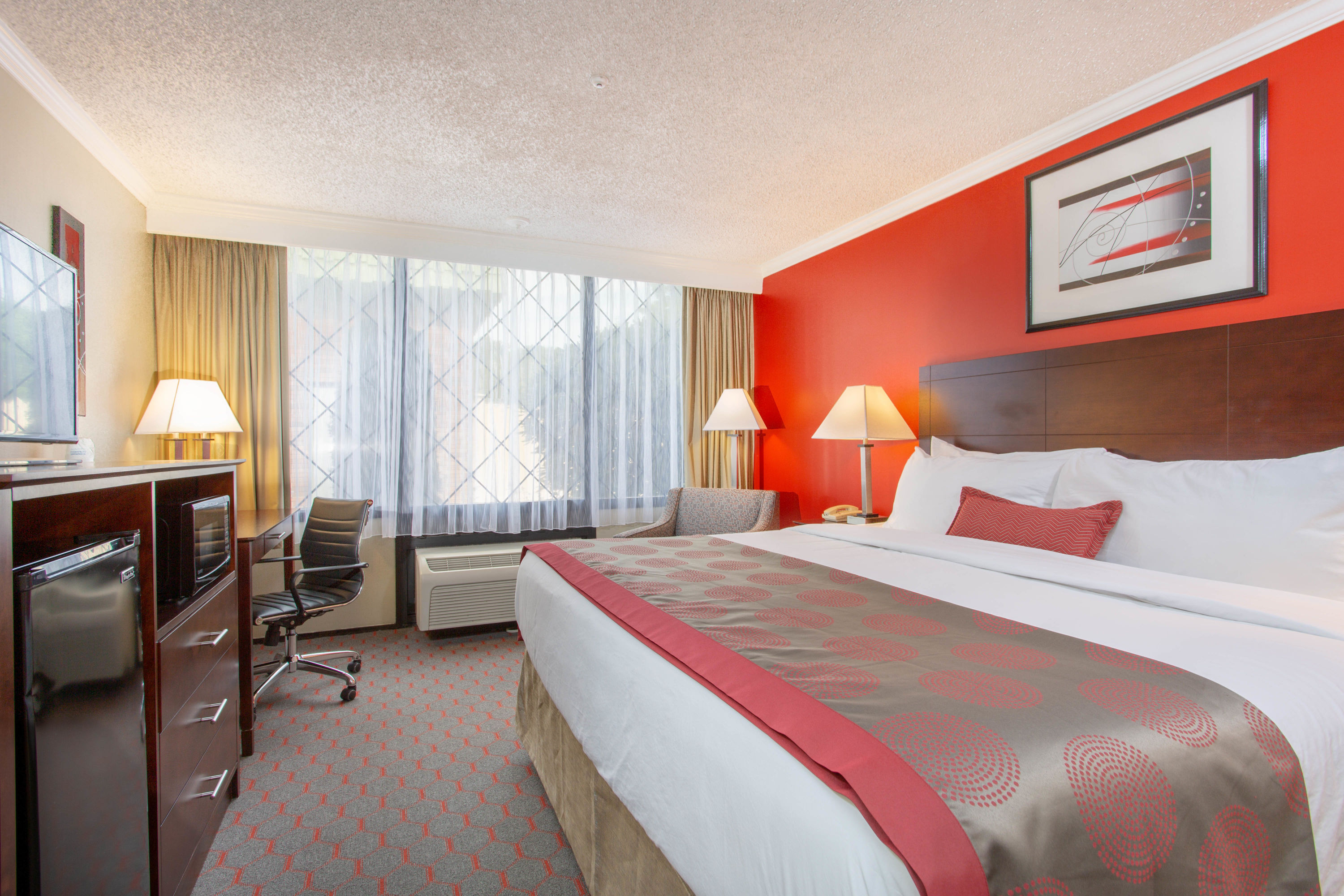 Guest room at the Ramada by Wyndham Lewiston Hotel & Conference Center in Lewiston, Maine