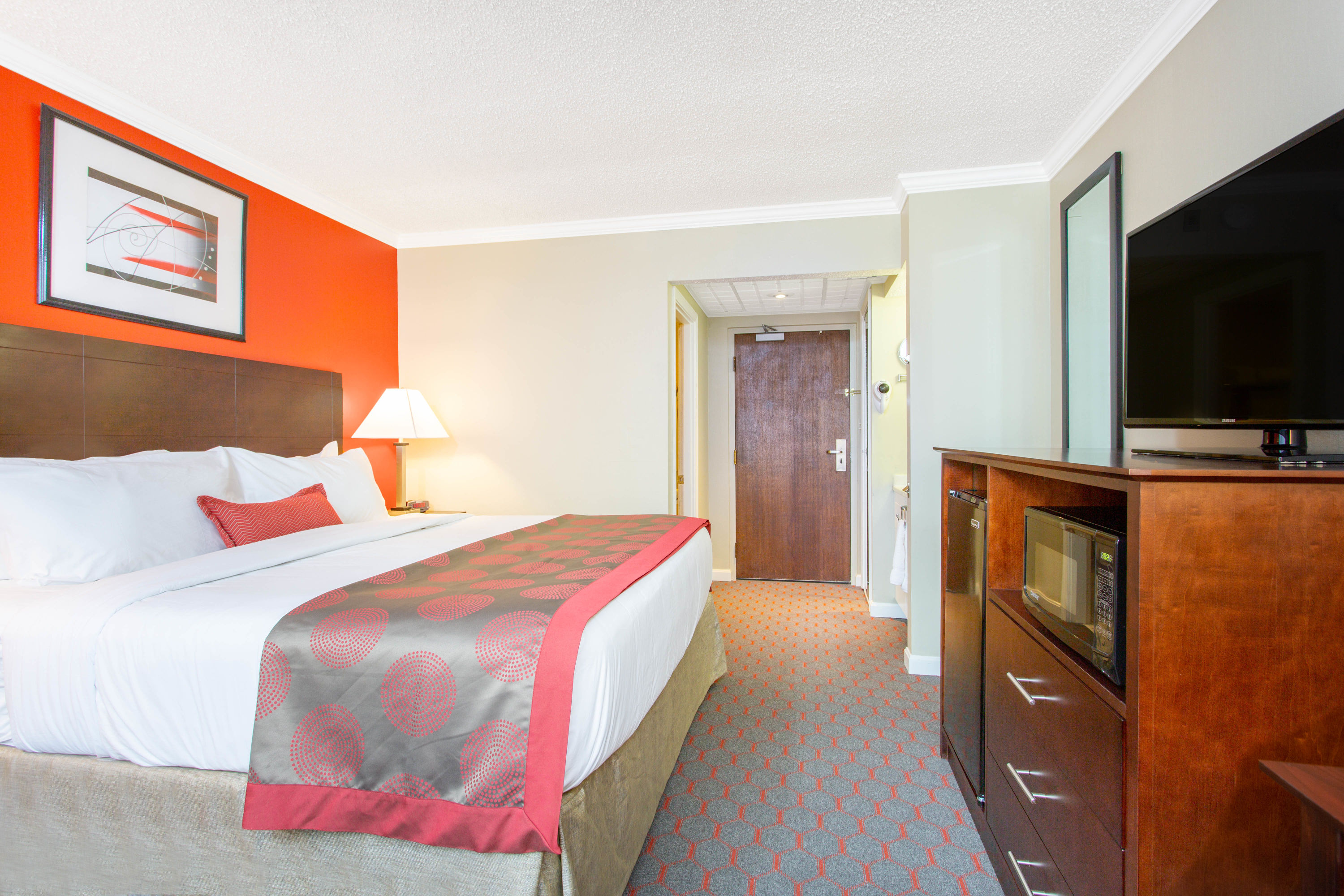 Guest room at the Ramada by Wyndham Lewiston Hotel & Conference Center in Lewiston, Maine