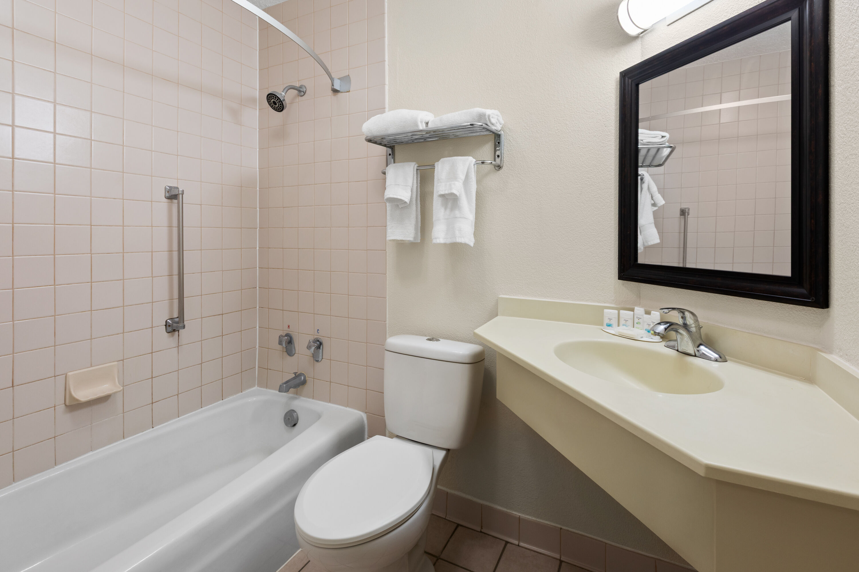 Guest room bath at the Ramada by Wyndham Grayling Hotel & Conference Center in Grayling, Michigan