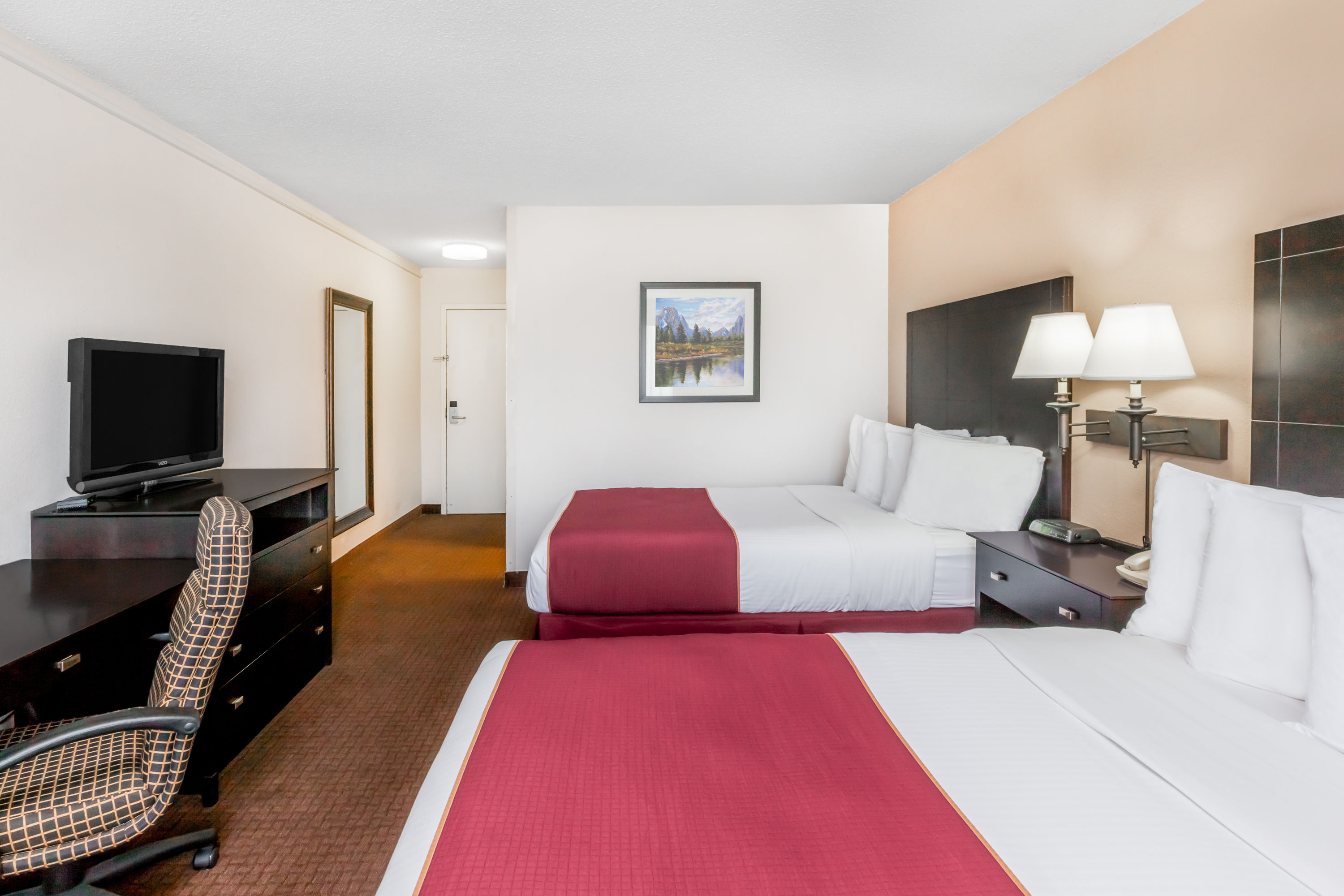 Guest room at the Ramada by Wyndham Grayling Hotel & Conference Center in Grayling, Michigan