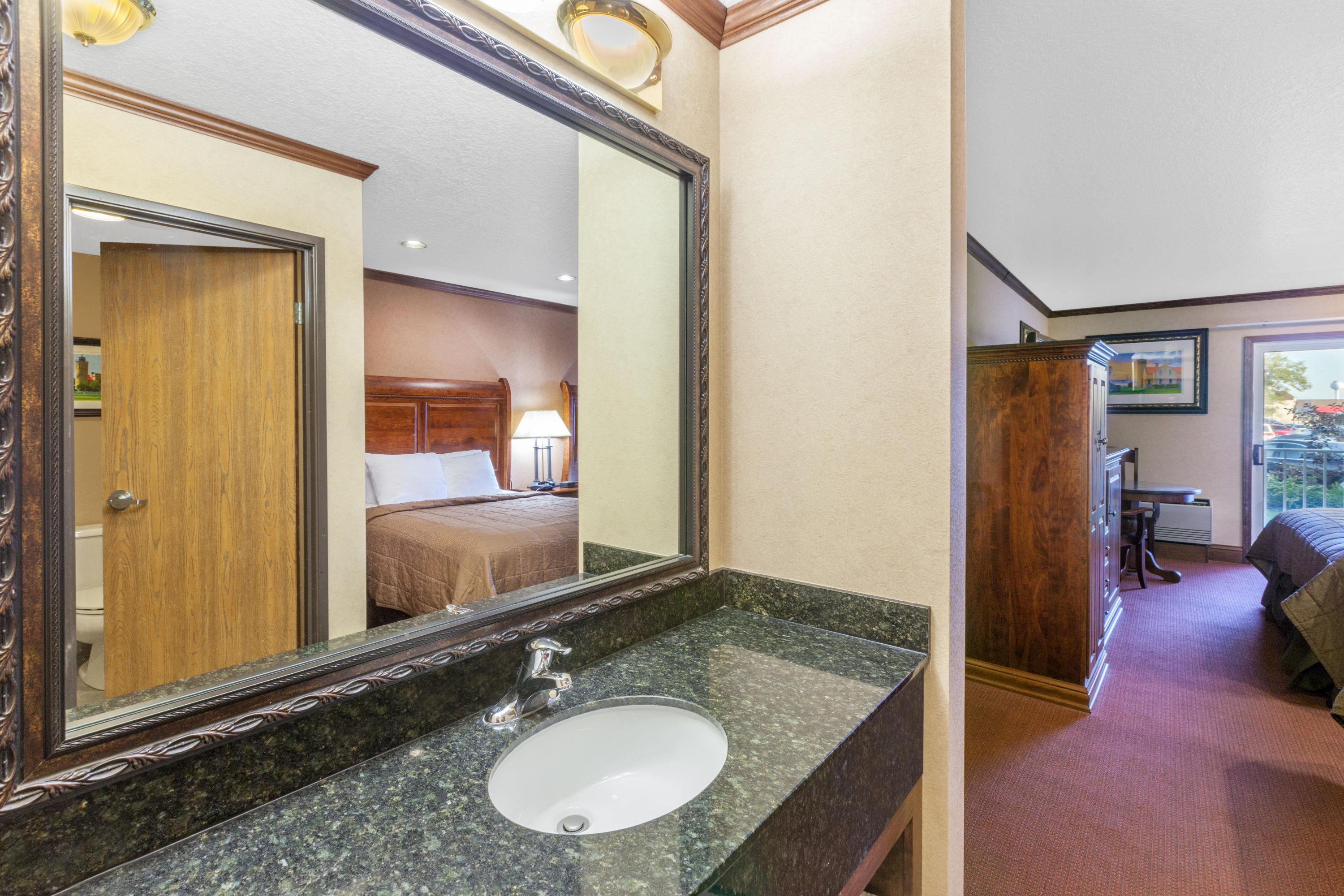 Guest room bath at the Ramada by Wyndham Mackinaw City Waterfront in Mackinaw City, Michigan