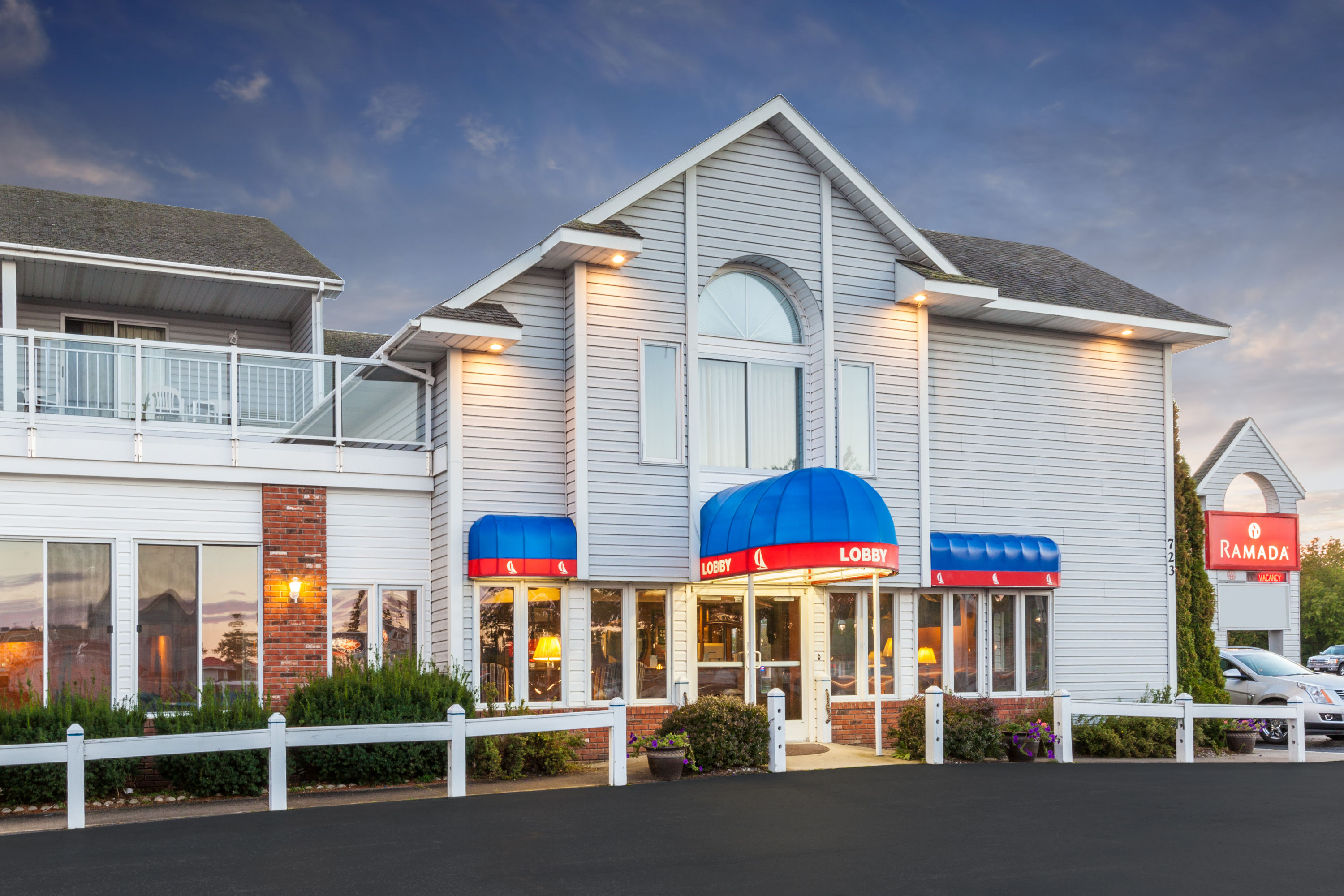 Exterior Dusk Image of Ramada by Wyndham Mackinaw City Waterfront hotel in Mackinaw City, Michigan