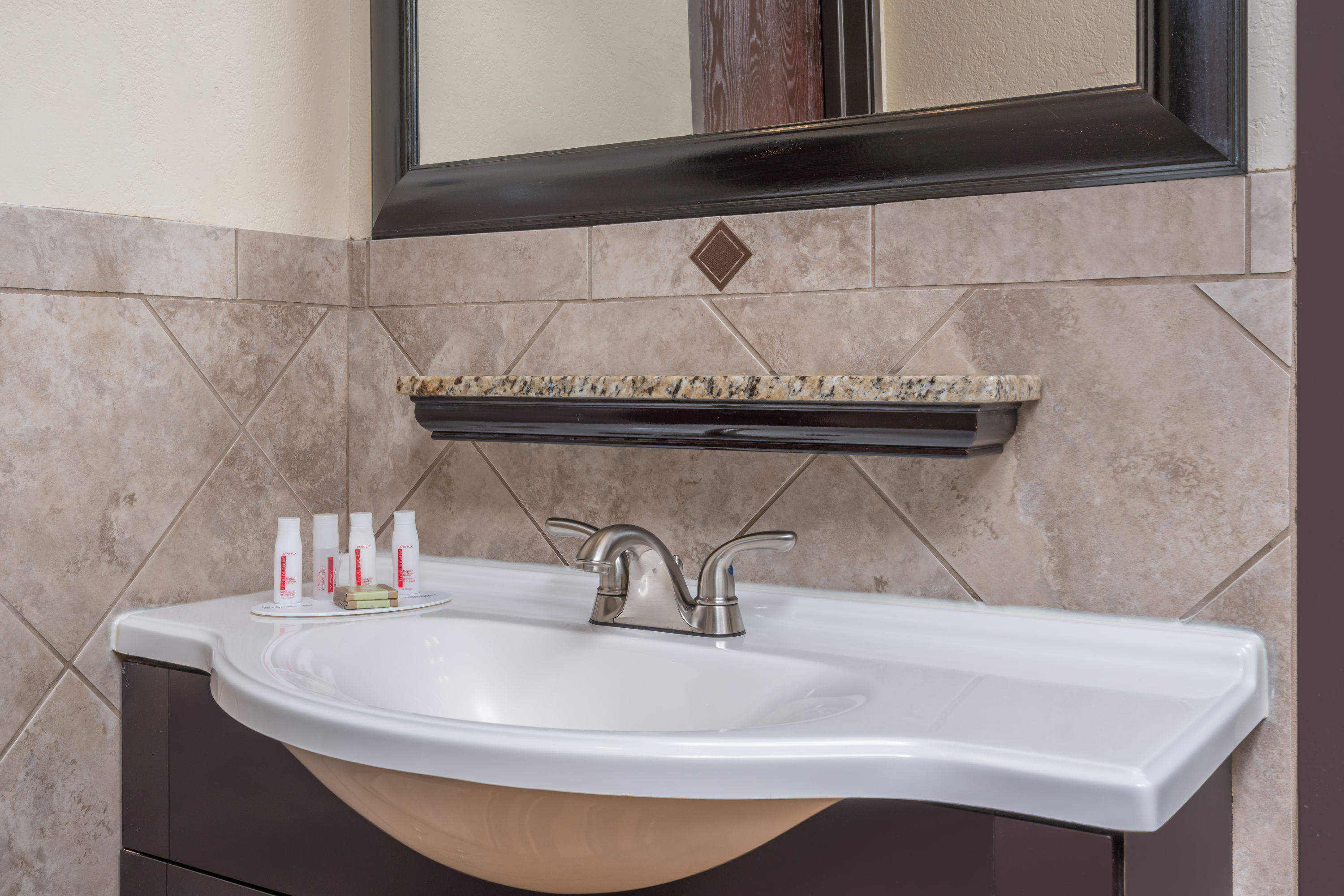 Guest room bath at the Ramada by Wyndham Minneapolis Golden Valley in Golden Valley, Minnesota