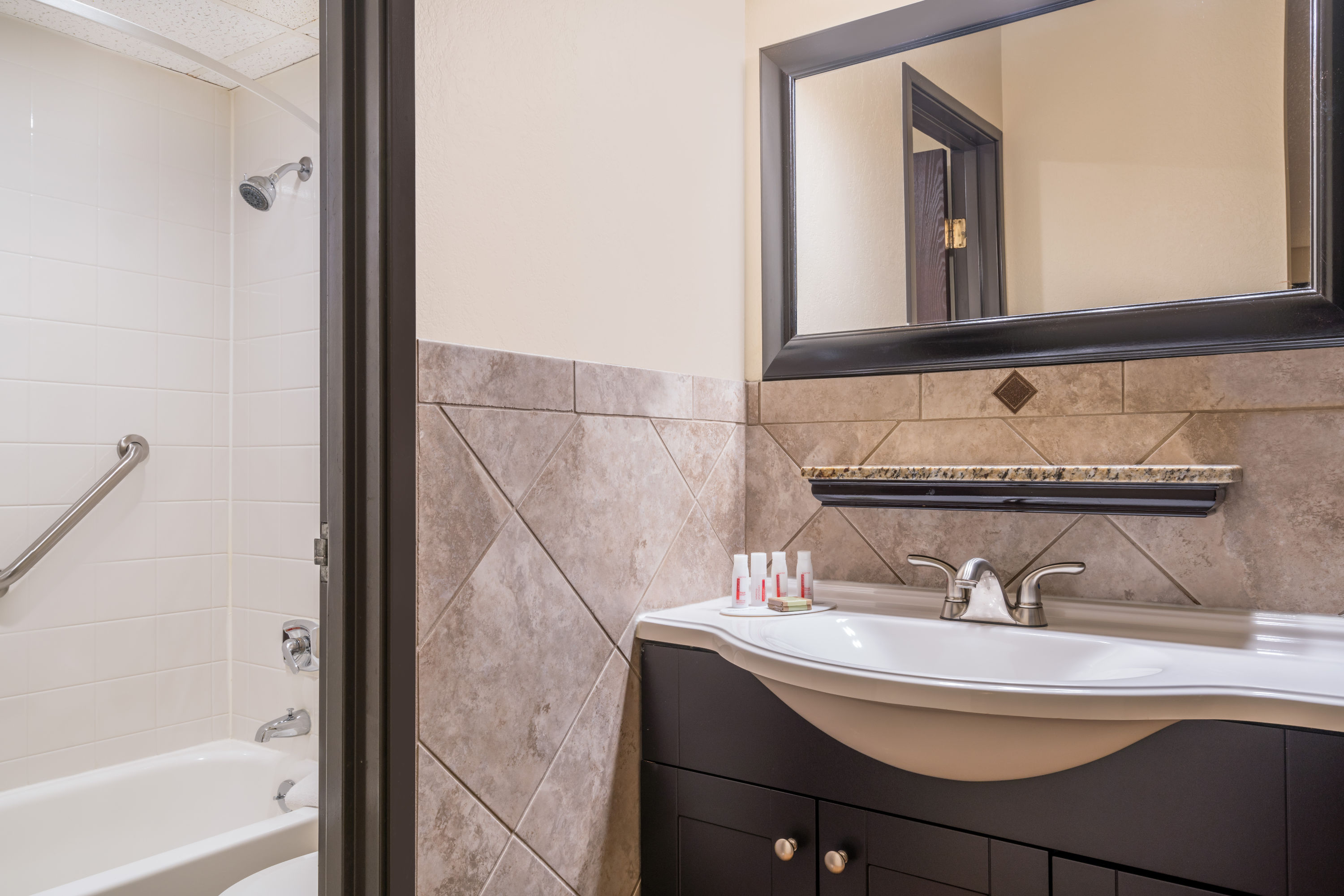 Guest room bath at the Ramada by Wyndham Minneapolis Golden Valley in Golden Valley, Minnesota