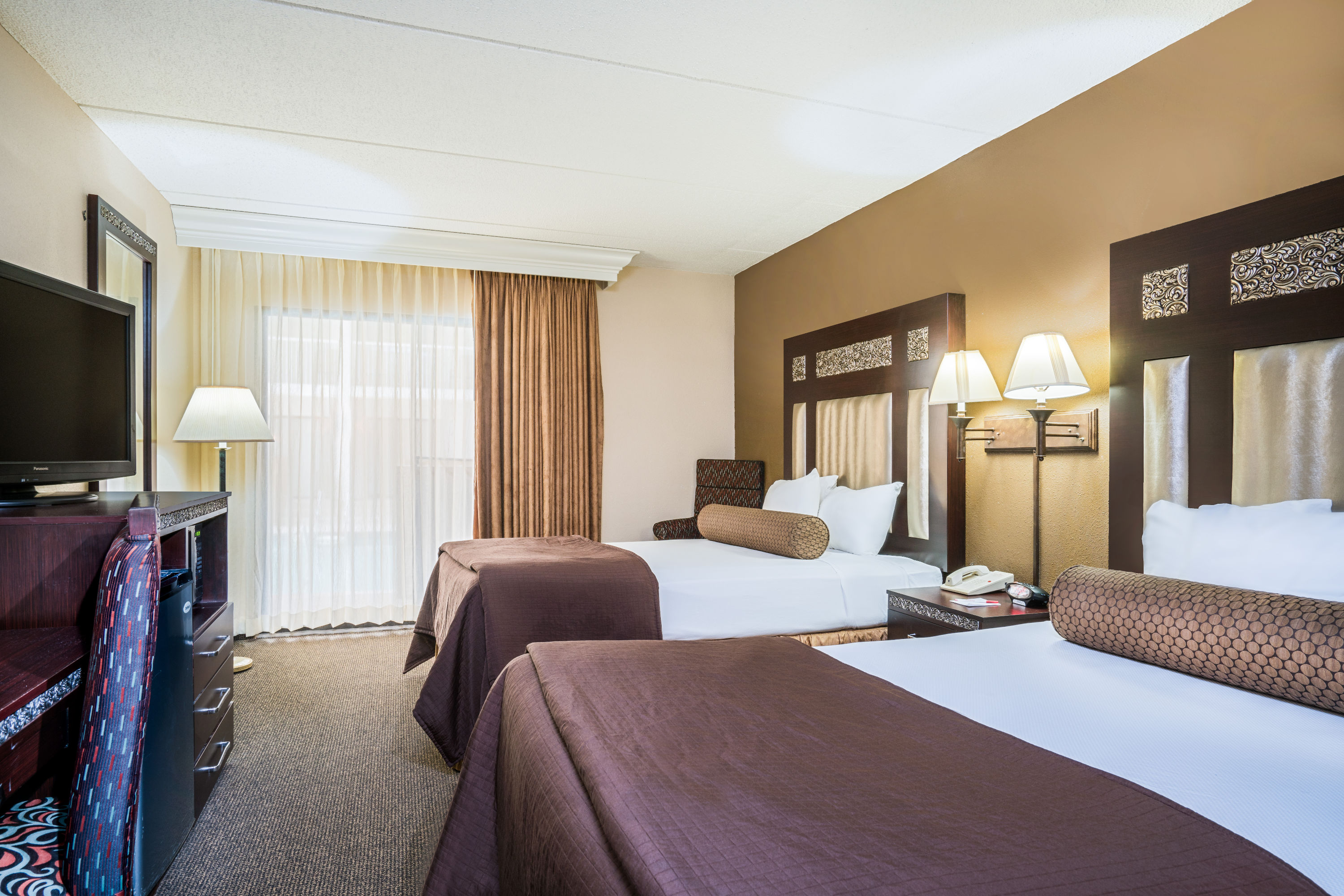 Guest room at the Ramada by Wyndham Plymouth Hotel & Conference Center in Plymouth, Minnesota