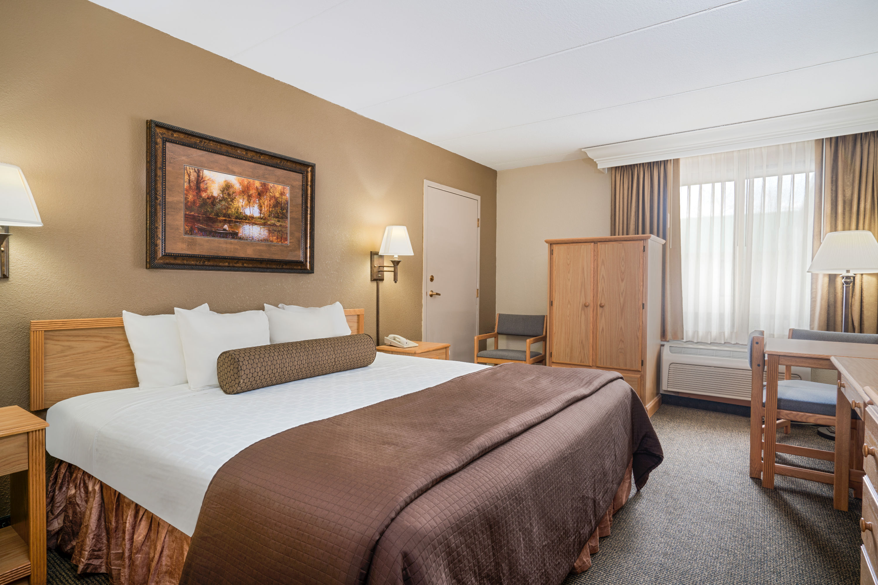 Guest room at the Ramada by Wyndham Plymouth Hotel & Conference Center in Plymouth, Minnesota