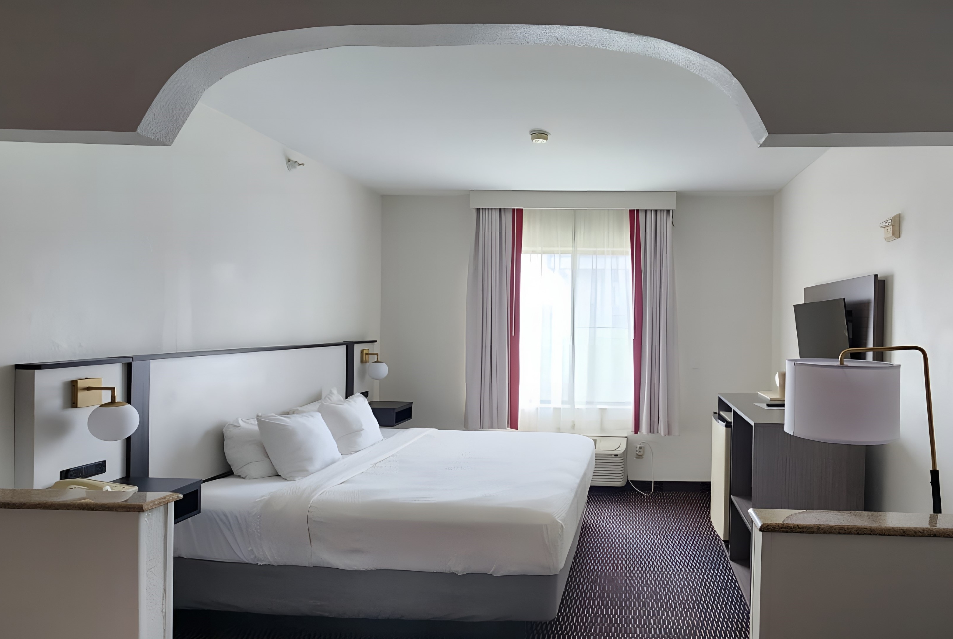 Guest room at the Ramada by Wyndham Columbia in Columbia, Missouri