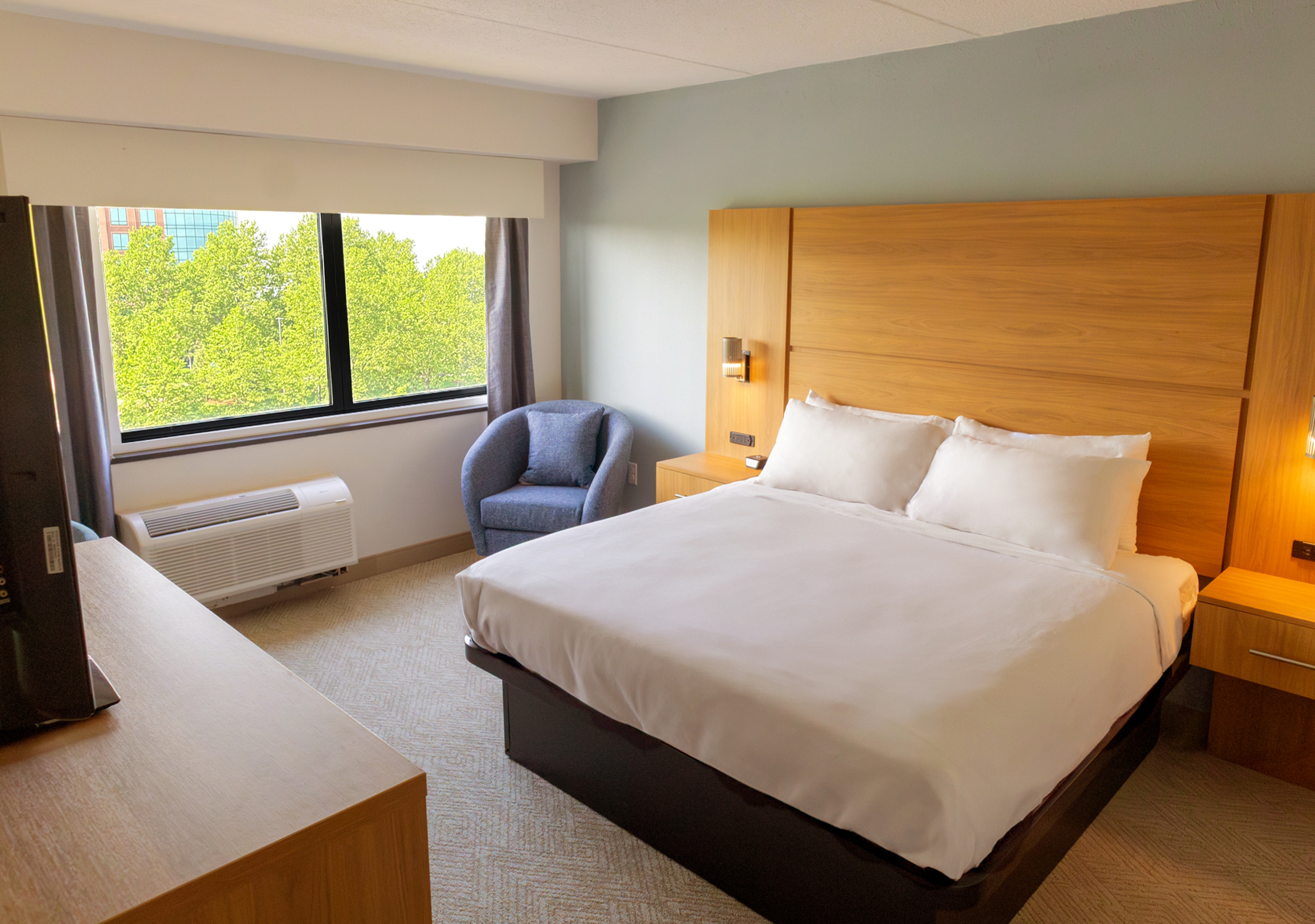 Guest room at the Elimwood Hotel, a Ramada by Wyndham in Maryland Heights, Missouri