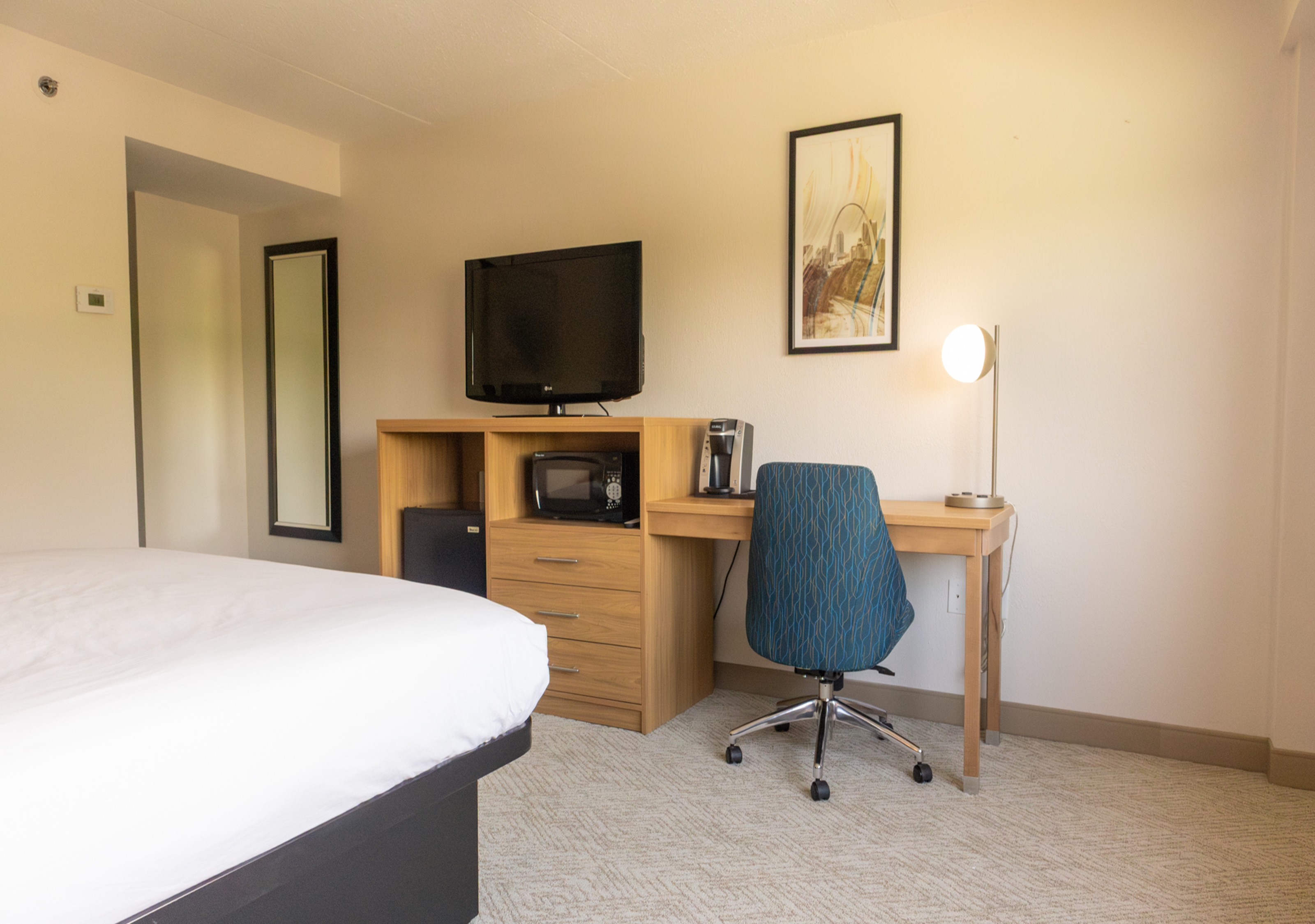 Guest room at the Elimwood Hotel, a Ramada by Wyndham in Maryland Heights, Missouri