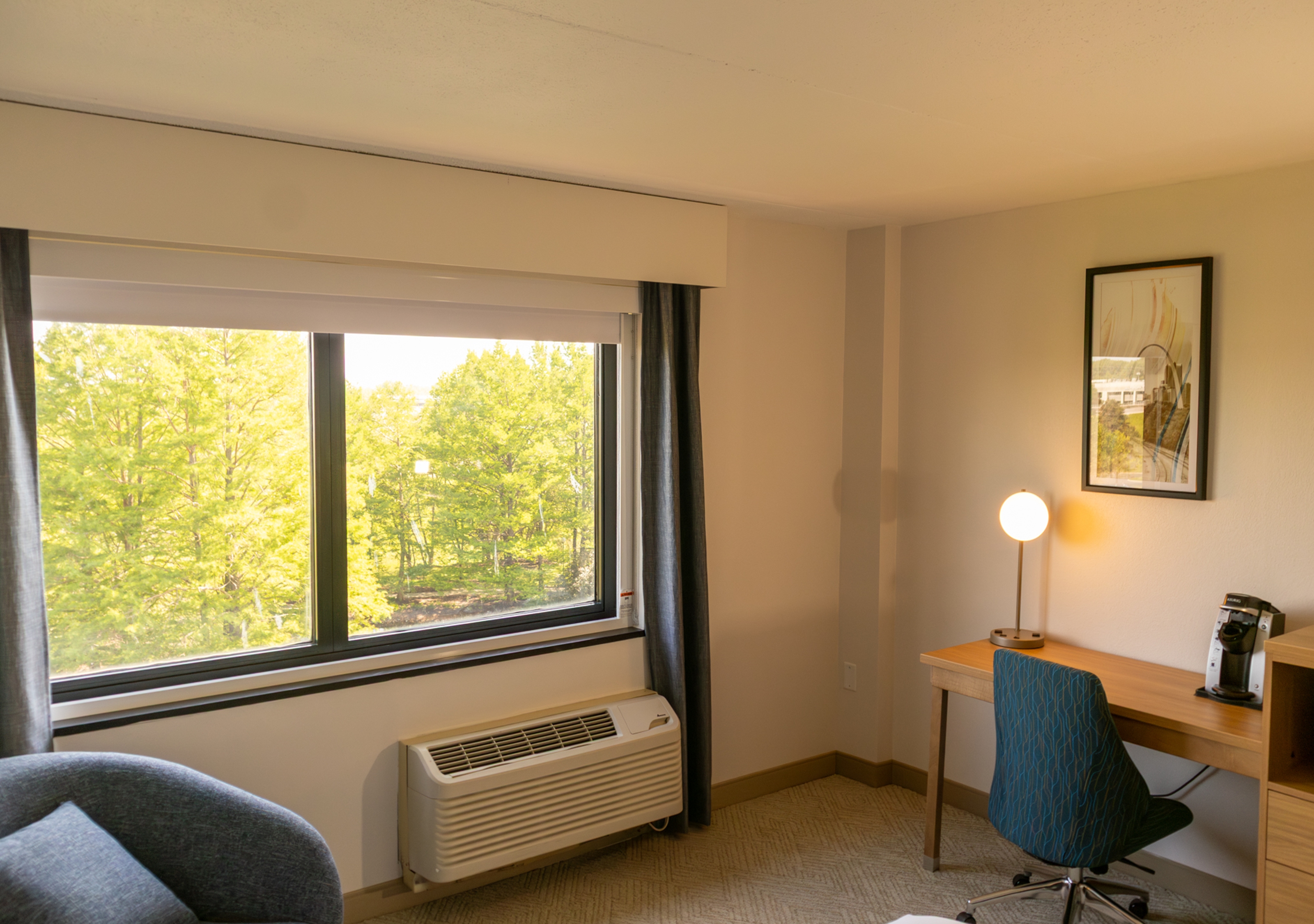 Guest room at the Elimwood Hotel, a Ramada by Wyndham in Maryland Heights, Missouri