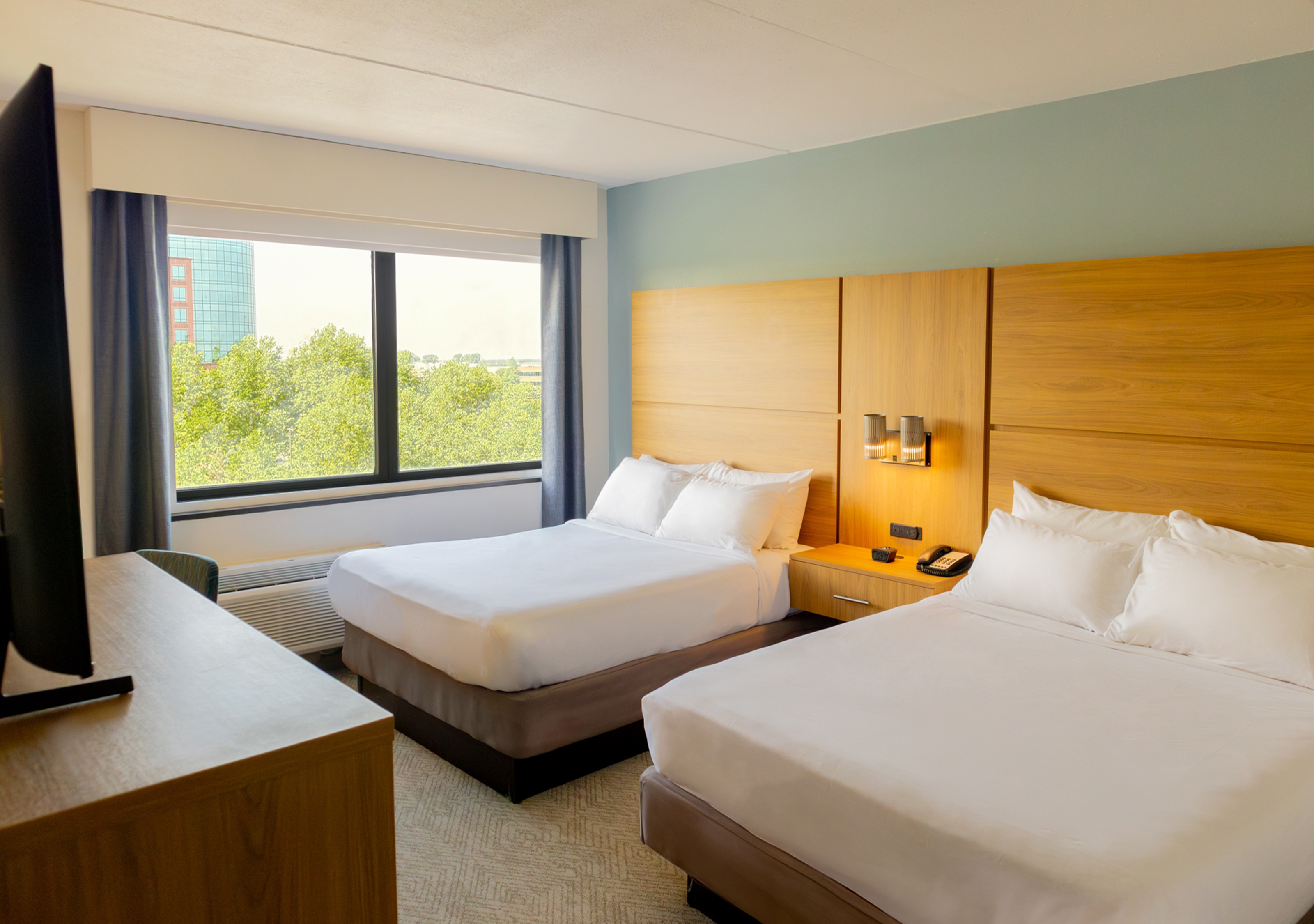 Guest room at the Elimwood Hotel, a Ramada by Wyndham in Maryland Heights, Missouri