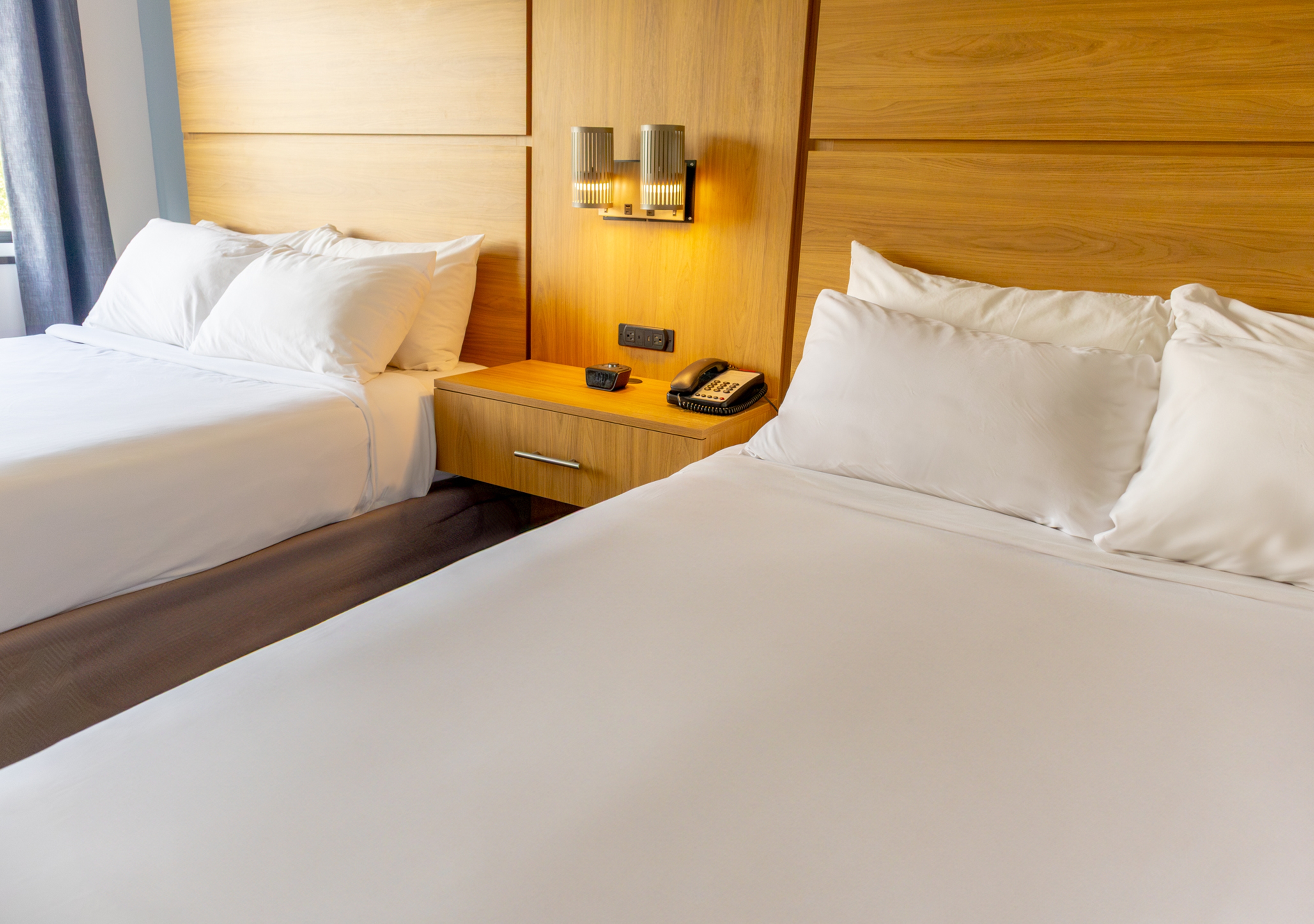 Guest room at the Elimwood Hotel, a Ramada by Wyndham in Maryland Heights, Missouri