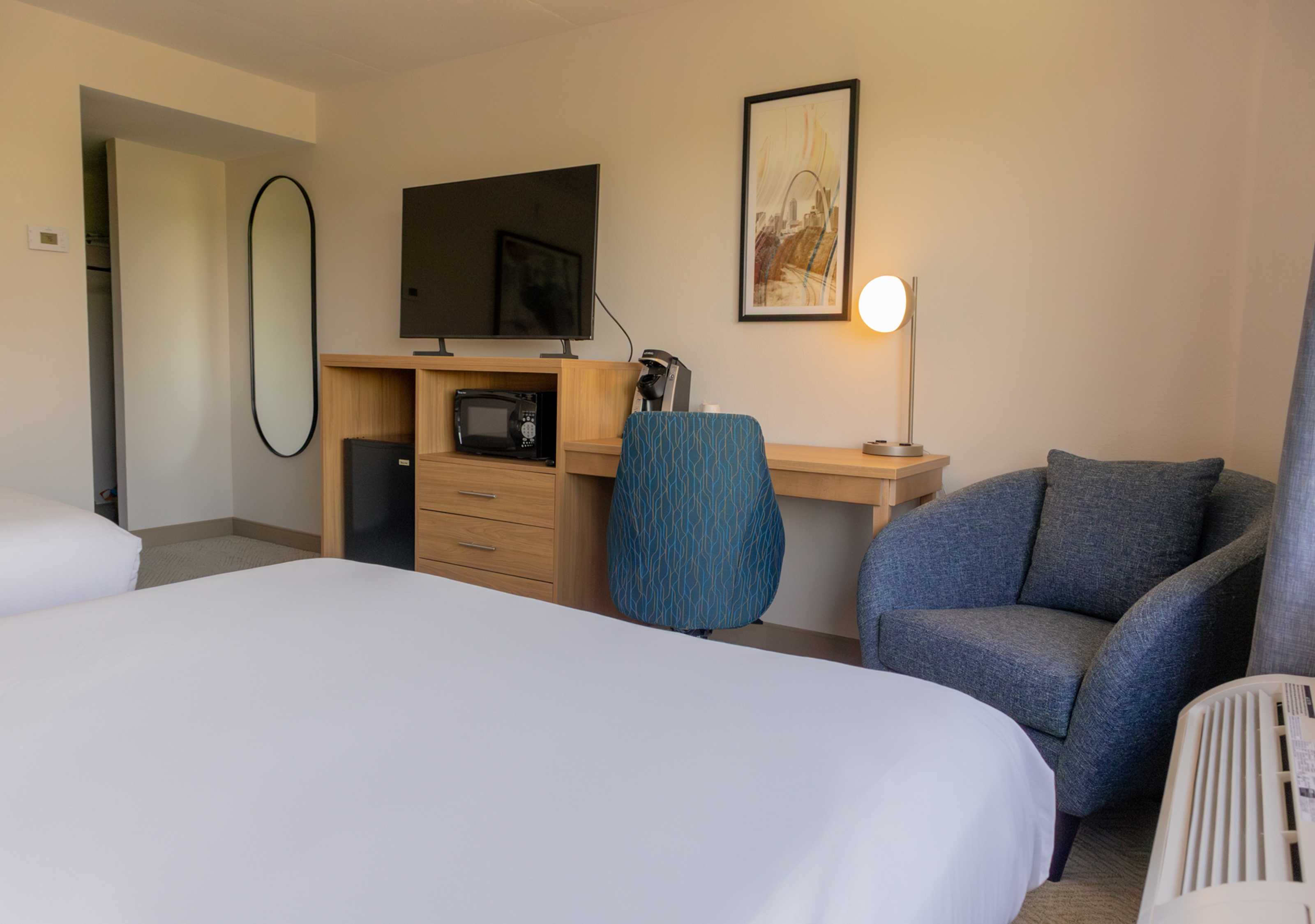 Guest room at the Elimwood Hotel, a Ramada by Wyndham in Maryland Heights, Missouri