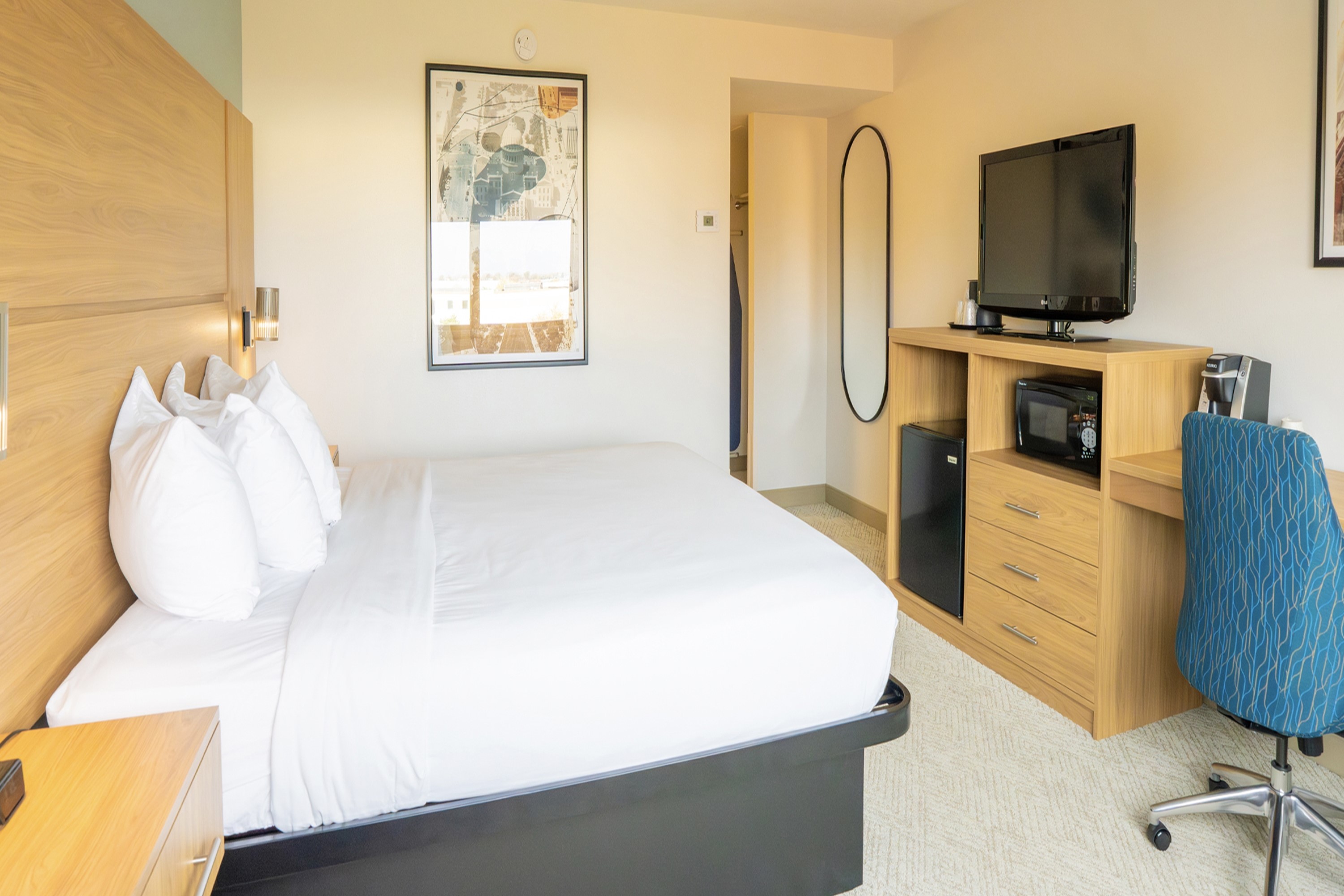 Guest room at the Elimwood Hotel, a Ramada by Wyndham in Maryland Heights, Missouri