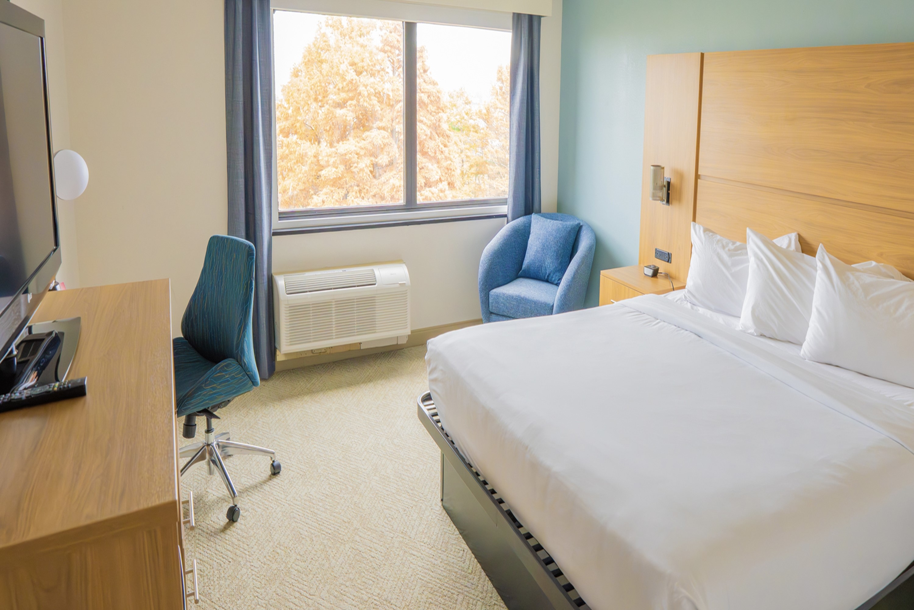 Guest room at the Elimwood Hotel, a Ramada by Wyndham in Maryland Heights, Missouri