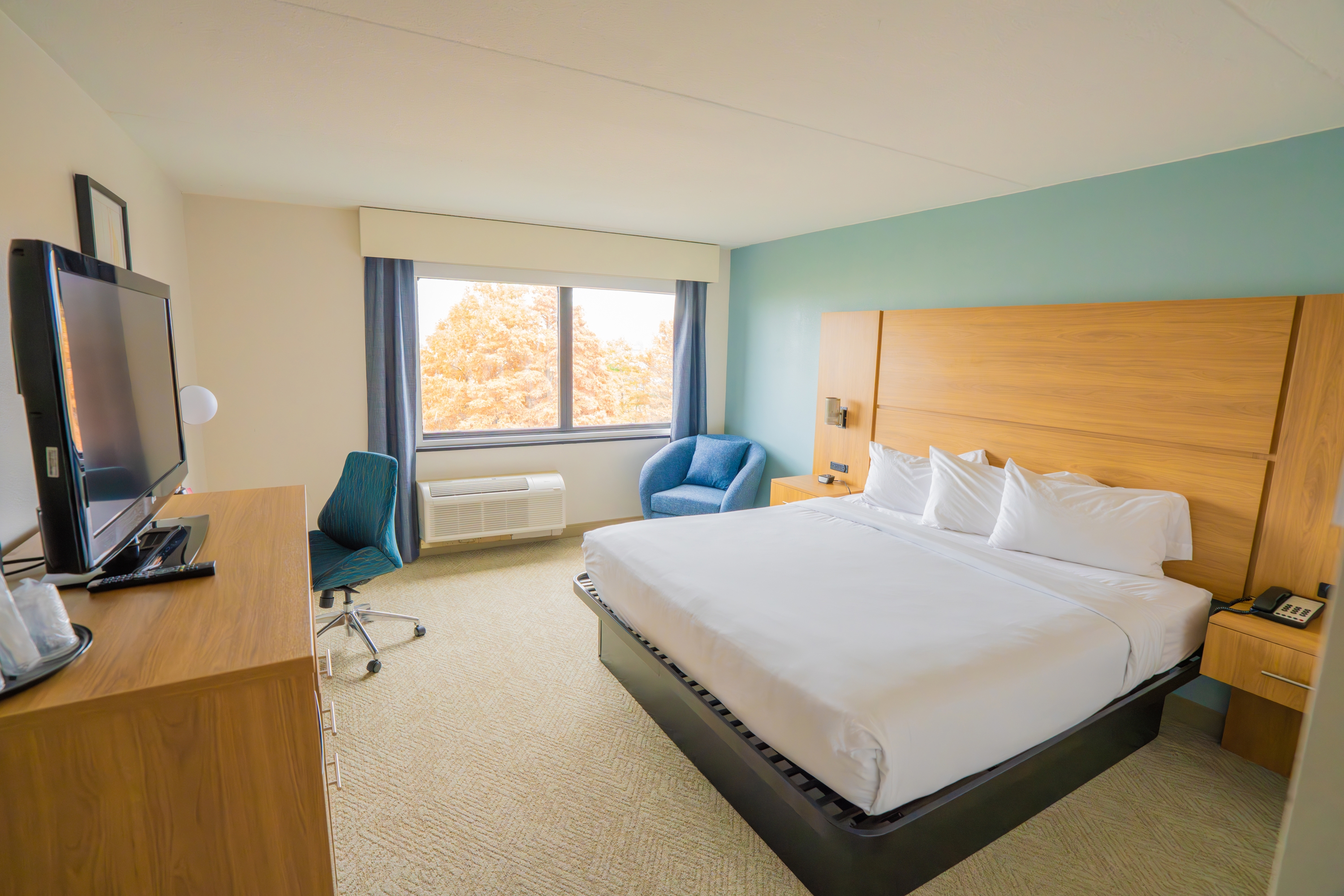 Guest room at the Elimwood Hotel, a Ramada by Wyndham in Maryland Heights, Missouri