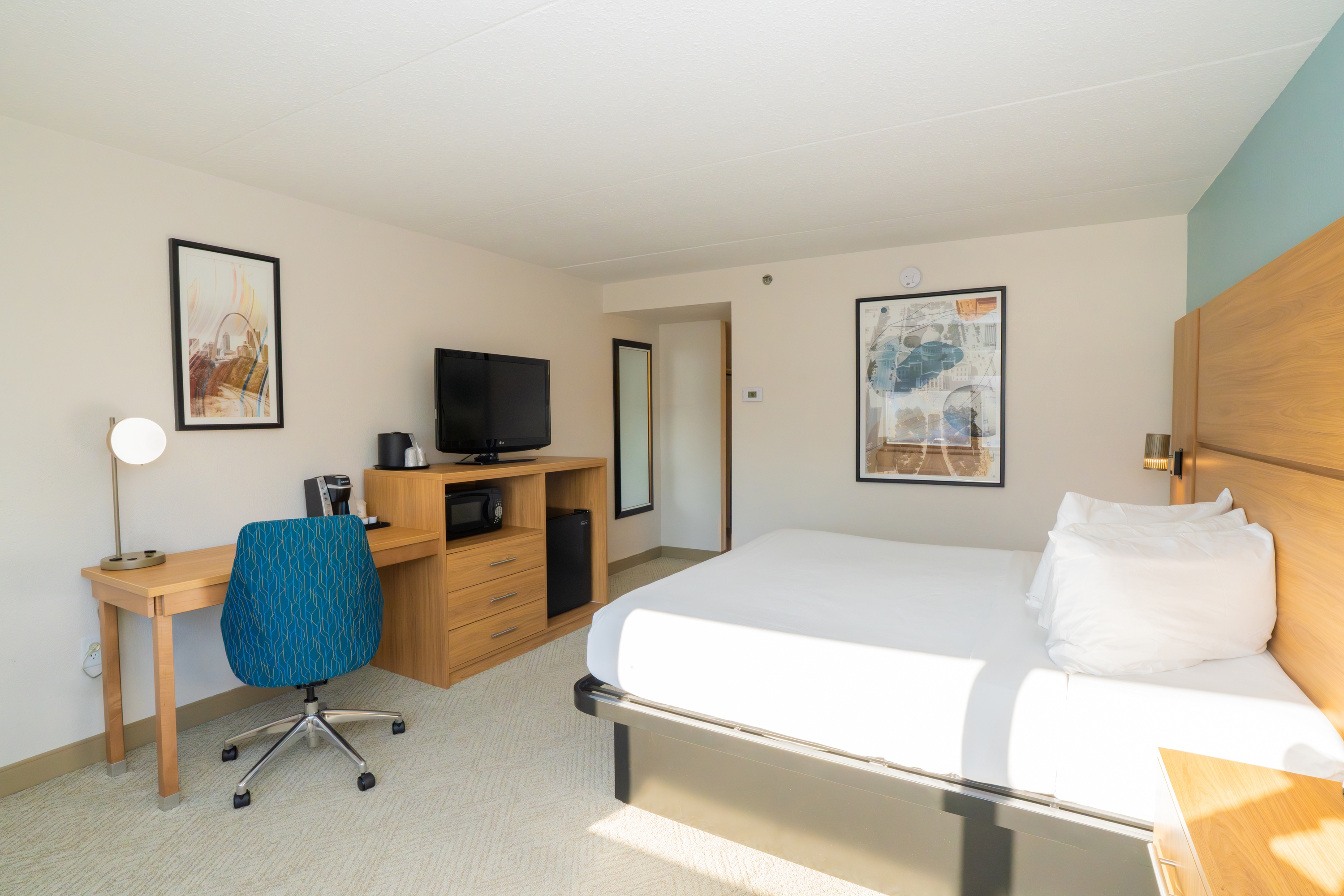 Guest room at the Elimwood Hotel, a Ramada by Wyndham in Maryland Heights, Missouri