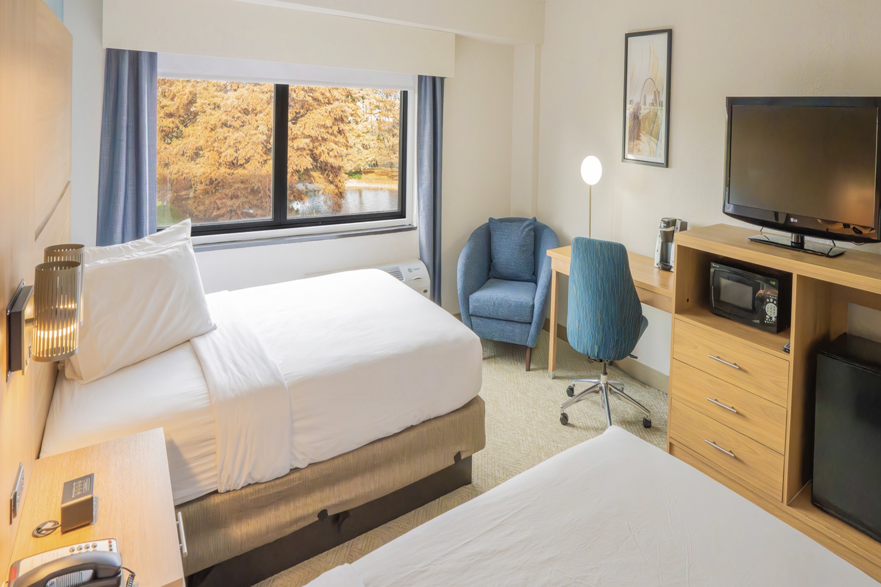 Guest room at the Elimwood Hotel, a Ramada by Wyndham in Maryland Heights, Missouri